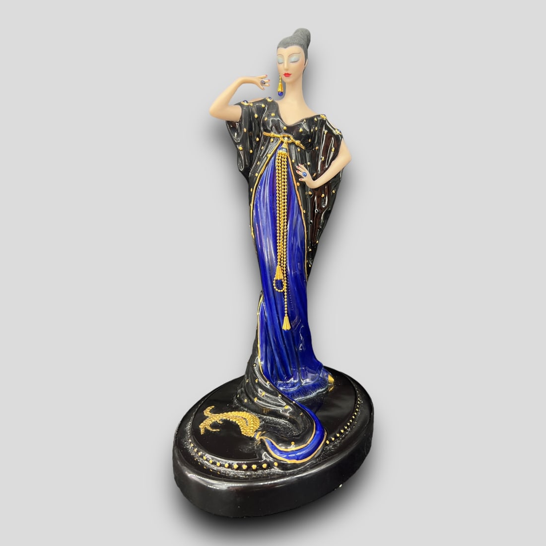 House of Erte The Franklin Mint 'Moonlight Mystique' Porcelain Figurine: The Franklin Mint 'Moonlight Mystique' Art Deco Style Porcelain Figurine. Signed on the bottom. #A 0089. Missing an earring.