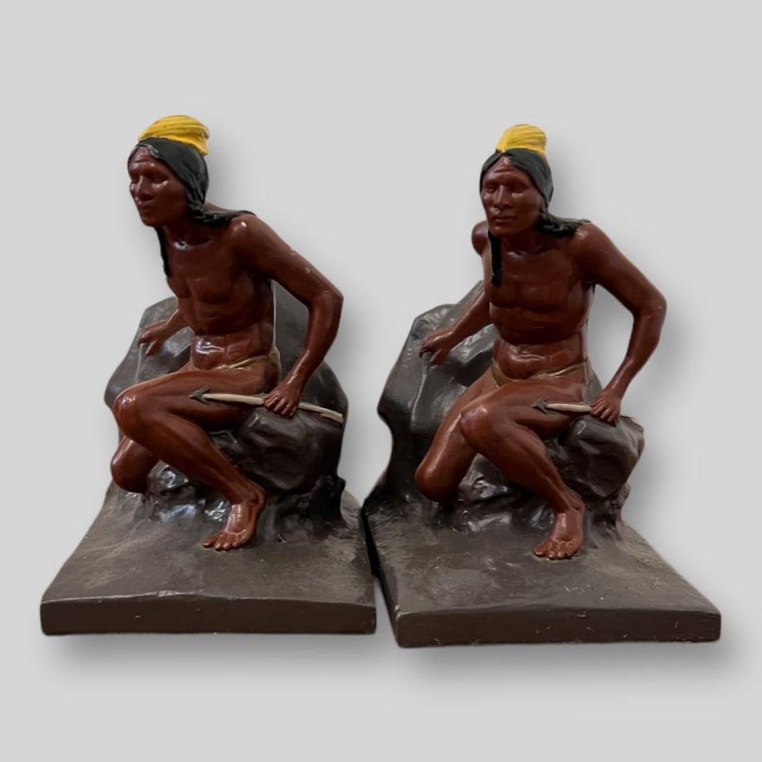 Pair of Painted Native American Bookends: Pair of Painted Native American Bookends.
