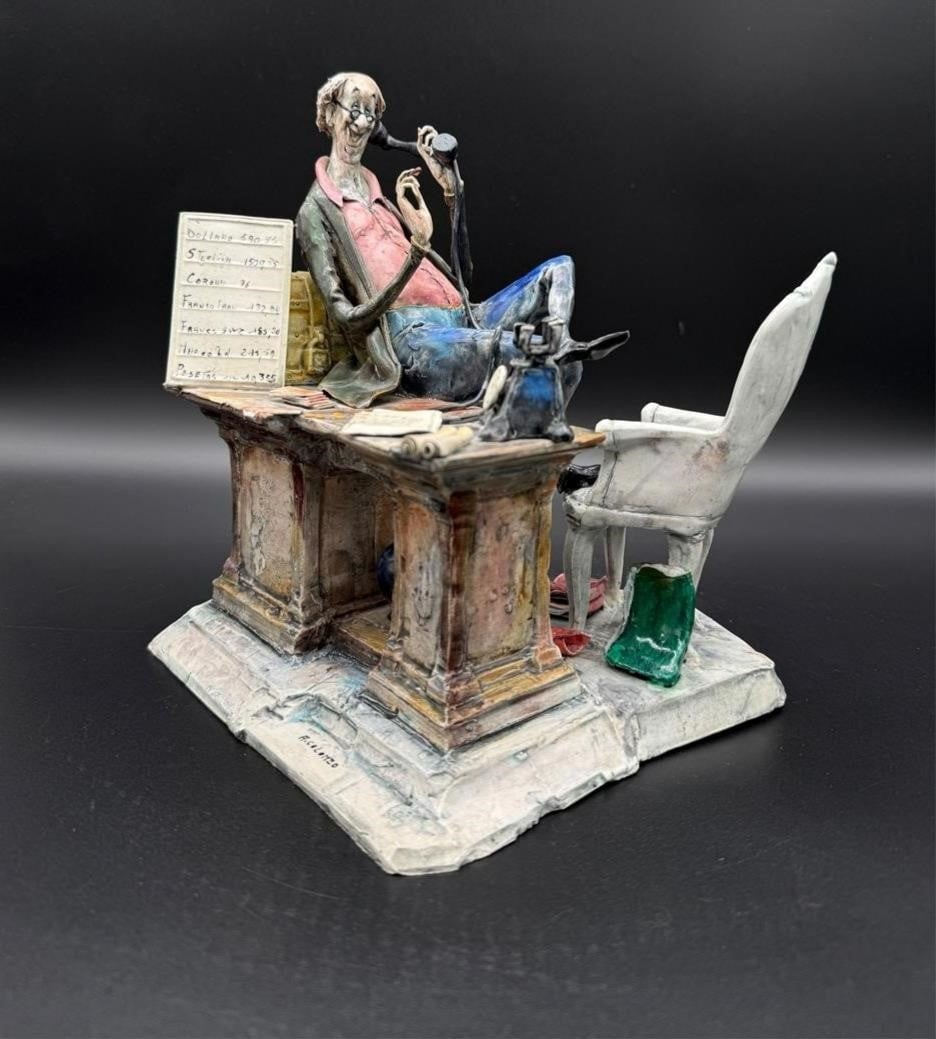 Adriano Colombo Man on Phone Ceramic Sculpture: Adriano Colombo Man on Phone Ceramic Sculpture. Lo Scricciolo. Depicts a salesman of gold + silver taking a phone call. Artist signed on the top of the base. Dimensions (in): 9.5 x 7.75 x 8.