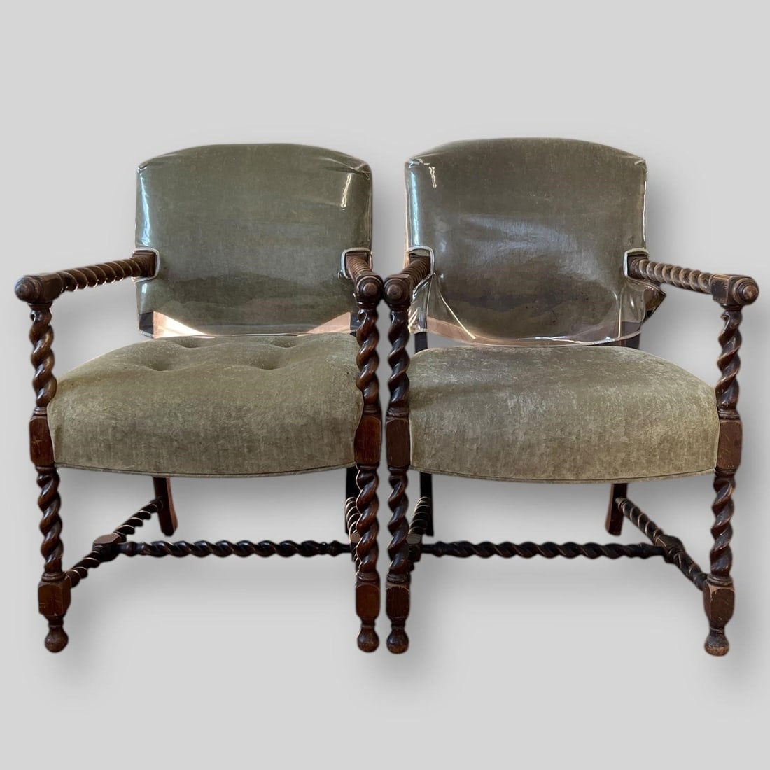 19th Century Pair Jacobean Barley Twist Armchairs: 19th Century Pair Jacobean Barley Twist Armchairs. Backs of the chairs are covered in plastic. The chairs are not signed. Approx. Dimensions (in): 35.75 x 23.5 x 23.5.