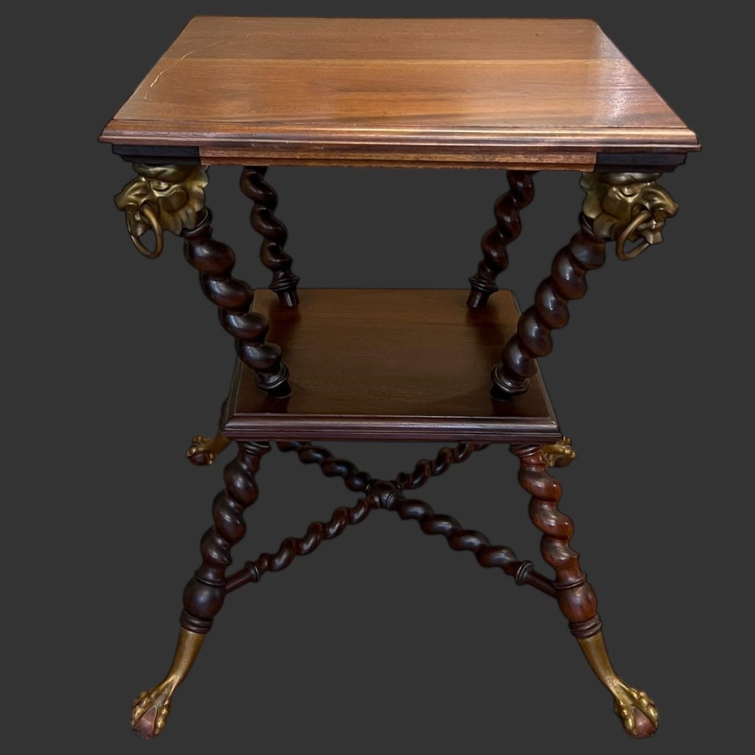 Brass Mounted Wooden Barley Twist 'Merklen' Table: Brass Mounted Wooden Barley Twist 'Merklen' Table. Attributed to Merklen Brothers of New York. Most likely Mahogany. Braided barley twist columns with brass lion's heads. Ball & claw feet. Approx. Dim