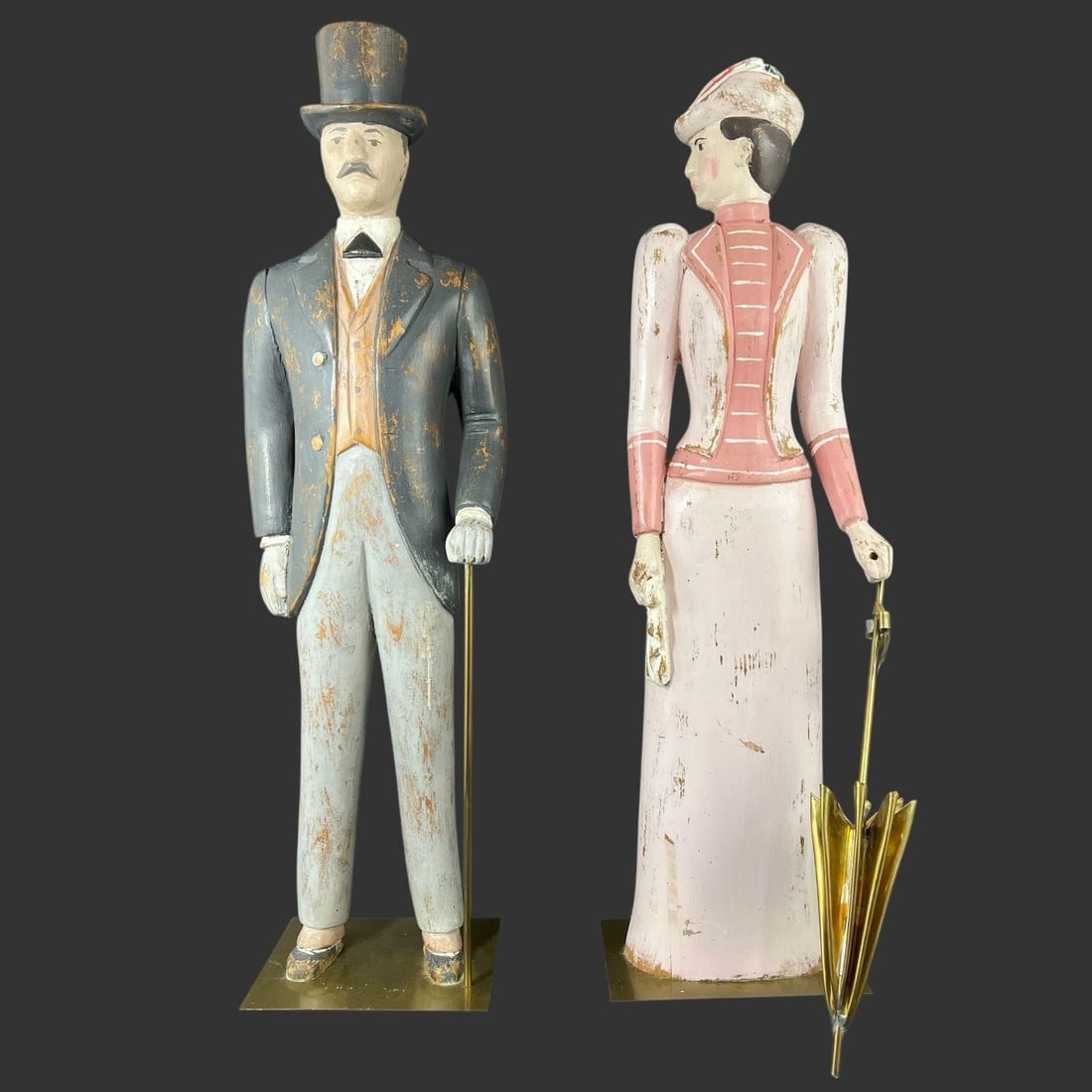 Pair of Carved Polychrome Man & Woman Figures: Pair of Carved Polychrome Man & Woman Figures. Painted Italian wood figures of standing man and woman in Edwardian dress. Great for store display. Approx. Tallest Sculpture Size (in): 24.25 x 6.75 x 5