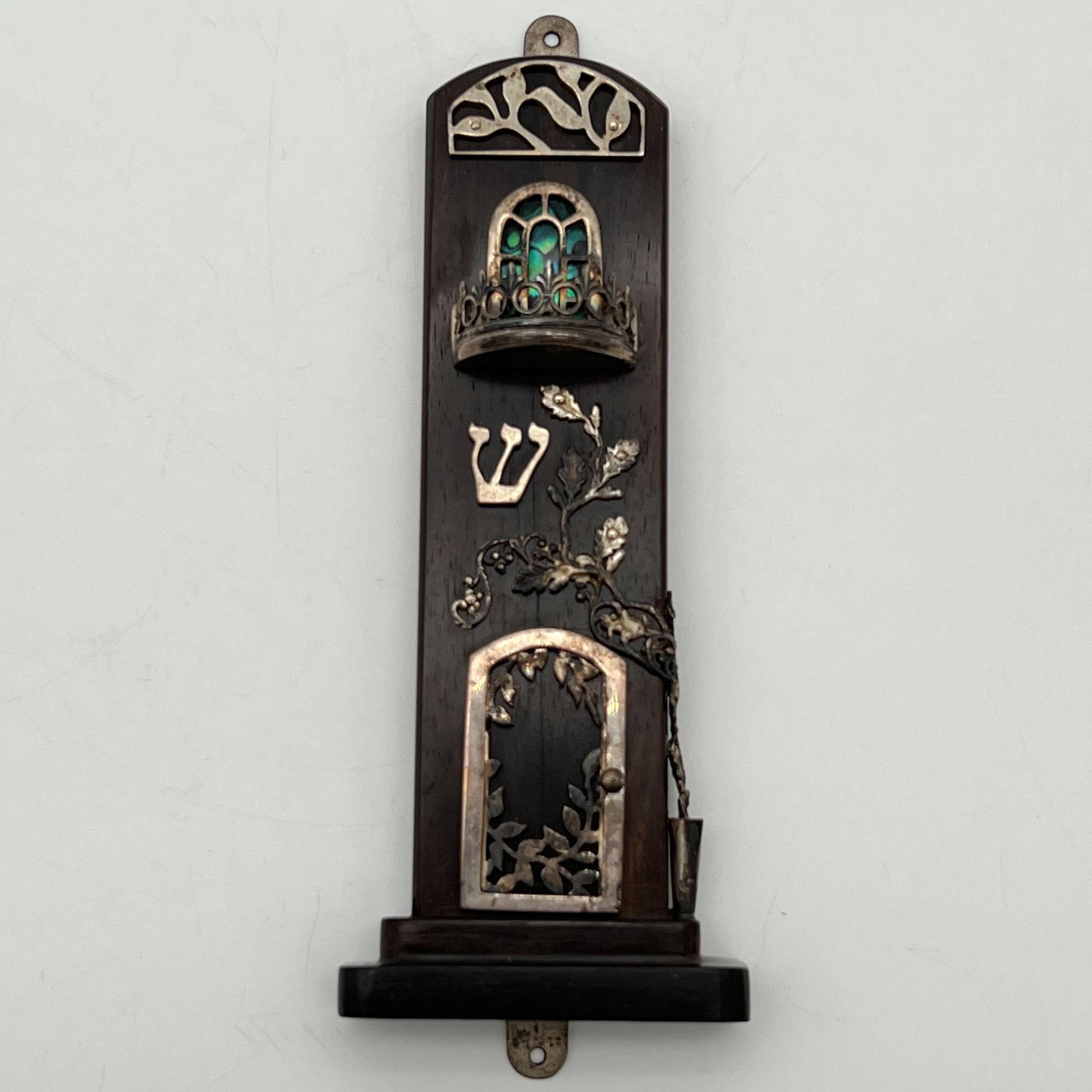 Judaica Jewish Mezuzah Wood & Sterling Silver: Judaica Jewish Mezuzah Wood & Sterling Silver. Shin.' Illegibly signed in Hebrew on the back. Approximate dimensions (in): 5.75 x 2 x 0.75. Buyer pays shipping cost. We provide in-house shipping for s