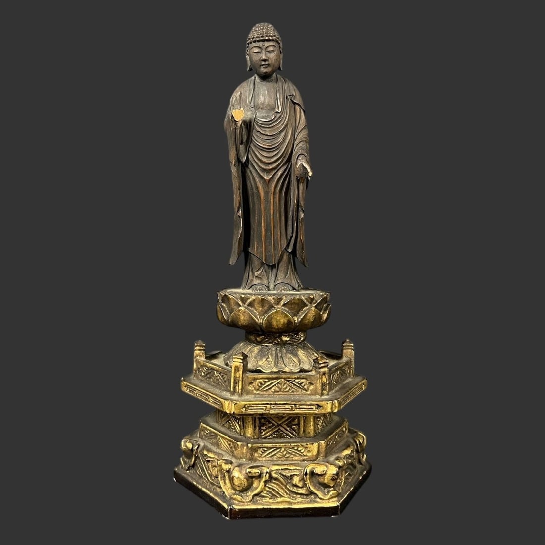 Standing Buddha Buddhism Carved Wooden Figurine: Standing Buddha Buddhism Carved Wooden Figurine. Unsigned. The figurine is missing a hand. Approximate dimensions (in): 7 x 3 x 2. Buyer pays shipping cost. We provide in-house shipping for some of th
