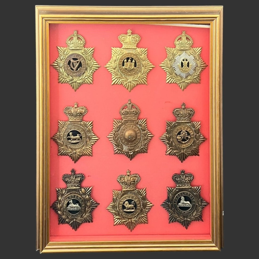 Framed Lot of 9 British Regimental Cap Badges: Framed Lot of 9 British Regimental Cap Badges. Approximate frame size (in): 20.25 x 16.25 x 1.75.. Buyer pays shipping cost. We provide in-house shipping for some of the items. Our shipping quote is o
