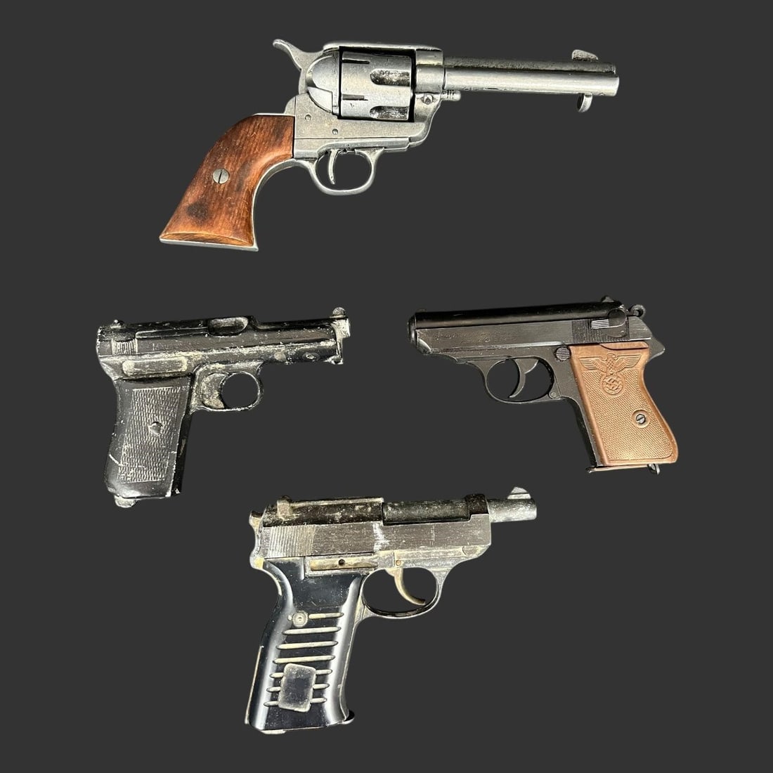 Lot of 4 Toy Guns Replica Pistols: Lot of 4 Toy Guns Replica Pistols. One is a German Walther PPK pistol, Colt 45 comes with original box. All 4 pistols are non-firing replicas. Approximate length of the largest gun (in): 10.75.. Buyer