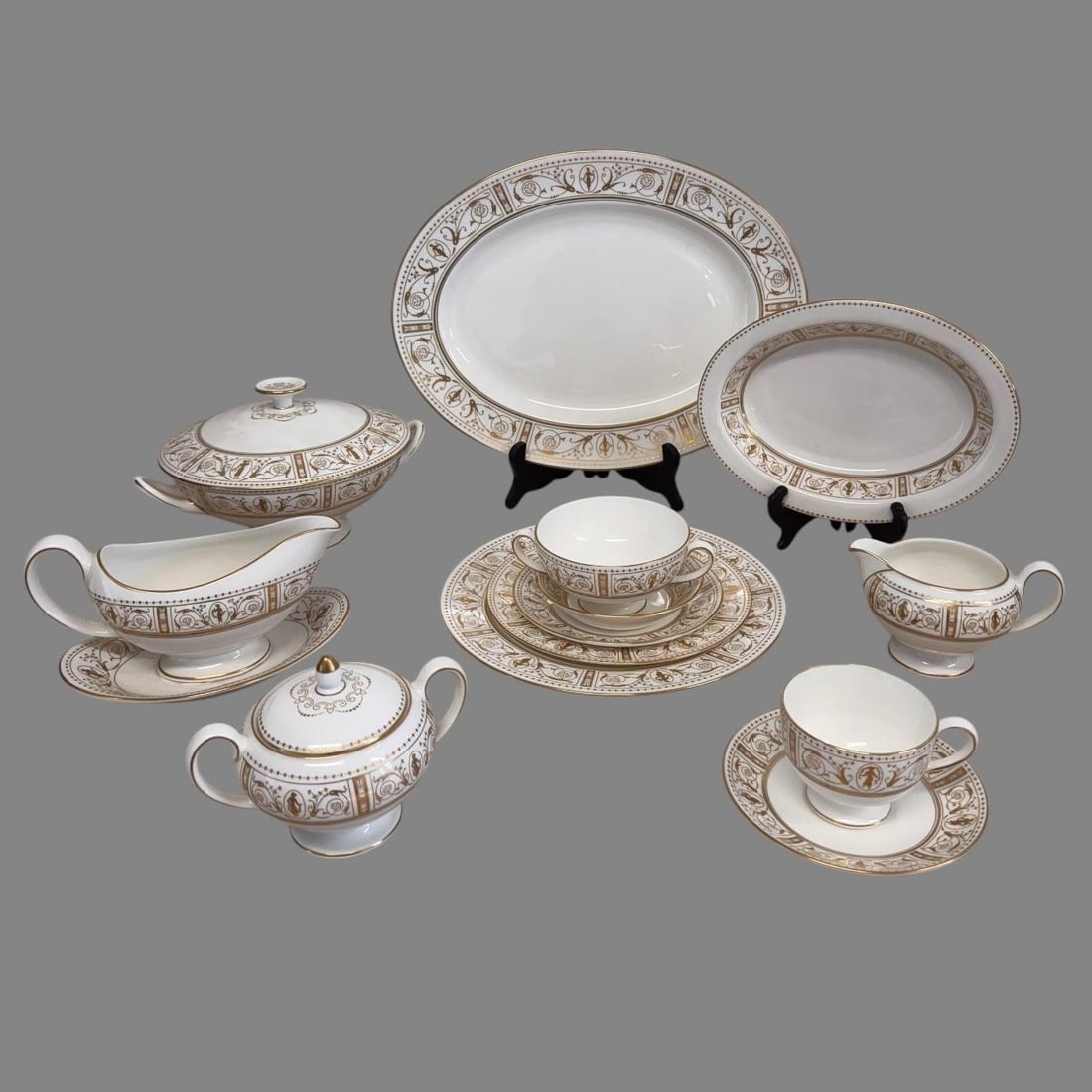 China Service for 12 Wedgewood Gold Grecian 96 pcs: China Service for 12 Wedgewood Gold Grecian 96 pcs. A complete set of bone china table service for 12 by Wedgewood of England with "Gold Grecian" pattern. 96 individual pieces in total. The set is in