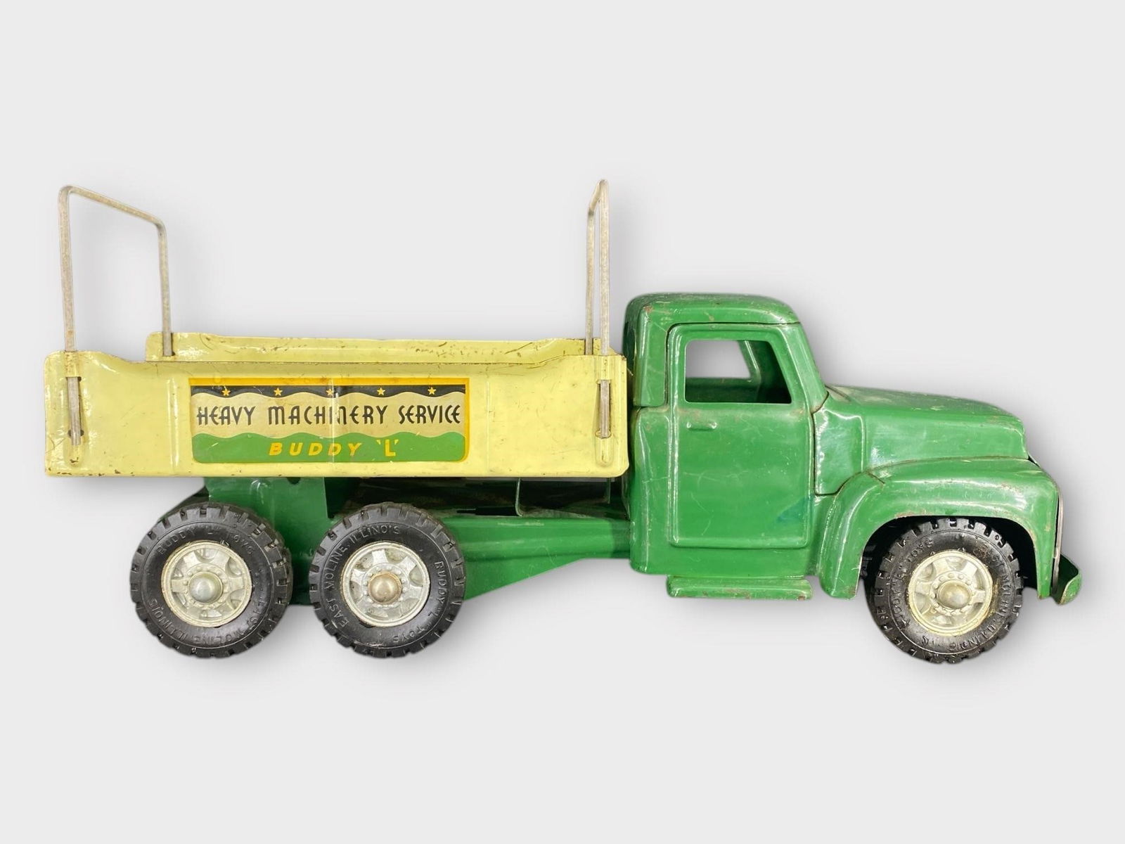 Buddy L Vintage Large Dumper Toy Truck 20 in.: Buddy L Vintage Large Dumper Toy Truck. Pressed steel, complete. Yellow, green. "Heavy Machinery Service". Approx. Size (in): 20