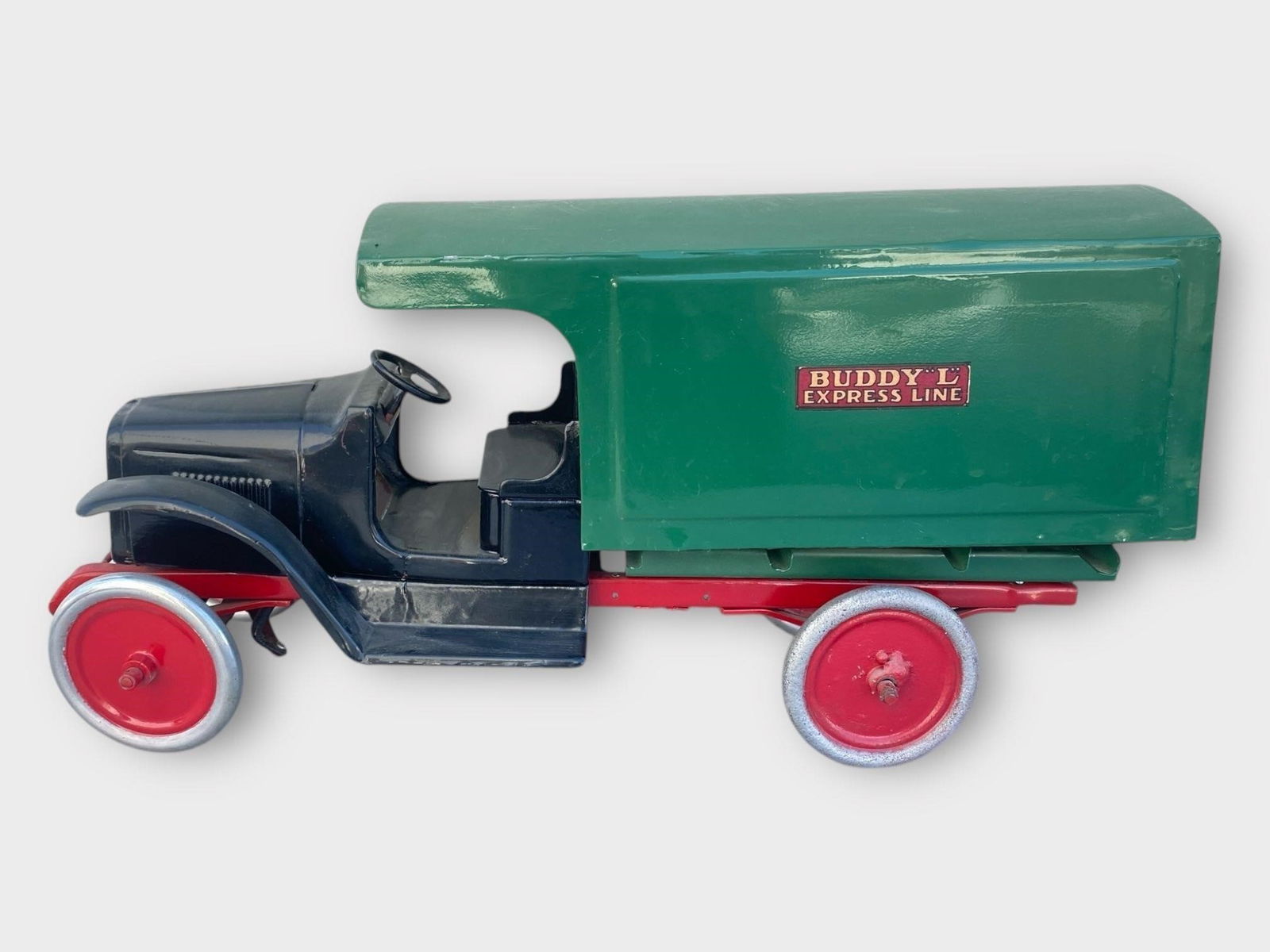 Buddy L Expressed Line Pressed Steel Truck: Buddy L Expressed Line Pressed Steel Truck . Green, black, red. Approx. Dimensions (in): 34 x 9 x 9