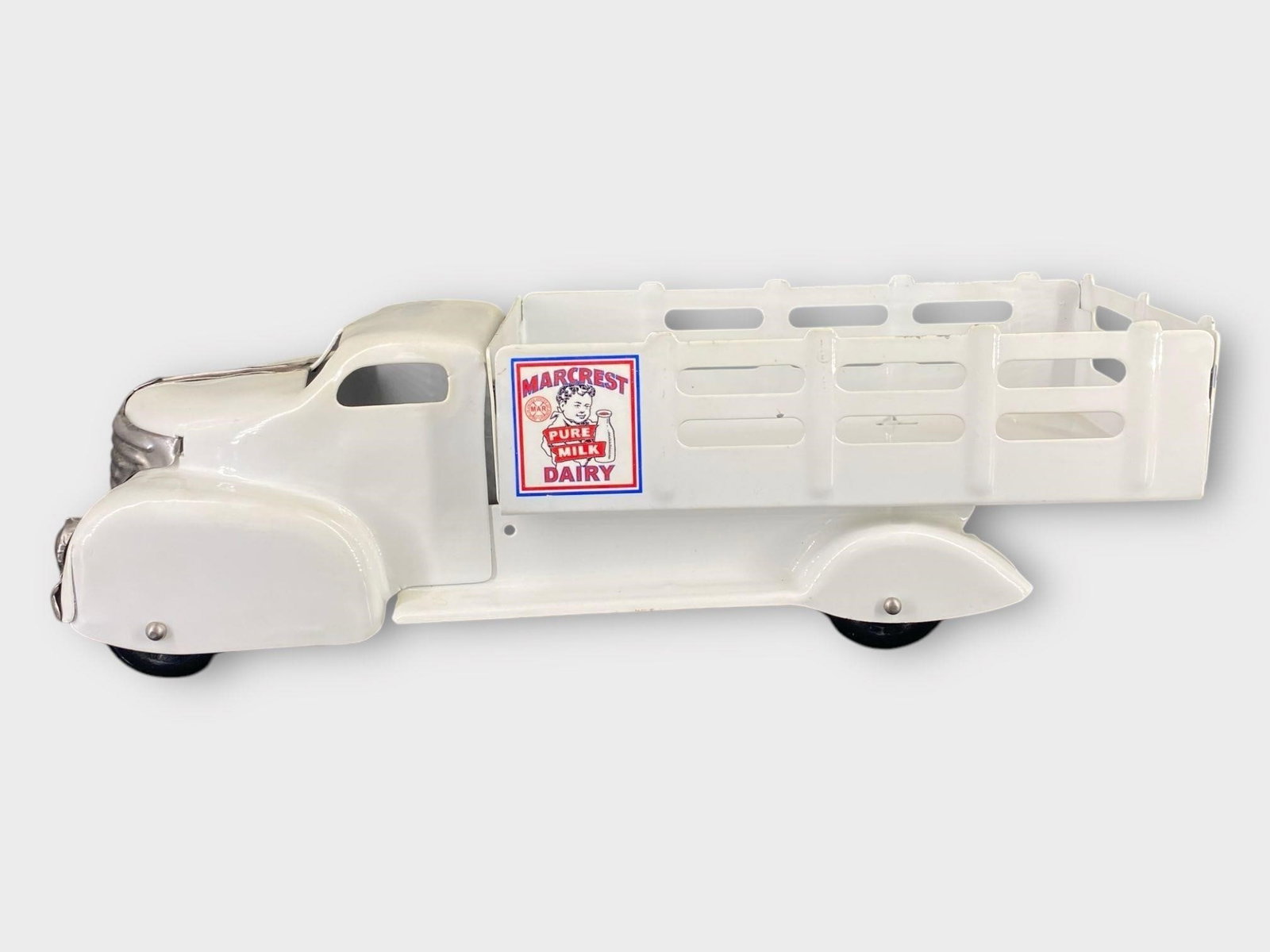 Marx Marcrest Dairy Pressed Steel Delivery Truck: Marx Marcrest Dairy Pressed Steel Delivery Truck . White. Approx. Dimensions (in): 13.5 x 4.25 x 4.75