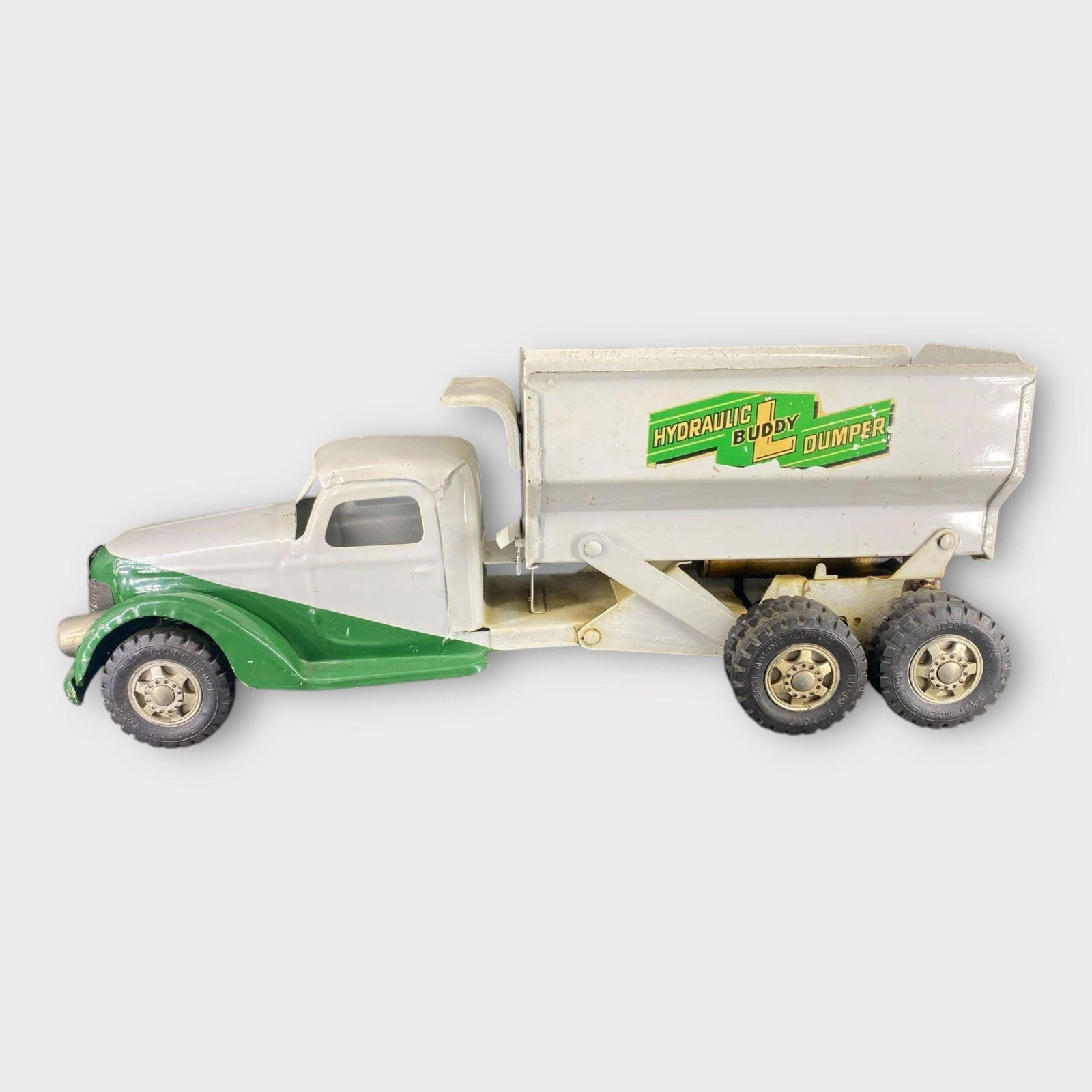 Buddy L Hydraulic Pressed Steel Dump Toy Truck: Buddy L Hydraulic Pressed Steel Dump Toy Truck . White, green. Approx. Dimensions (in): 21.5 x 8.5 x 6.5