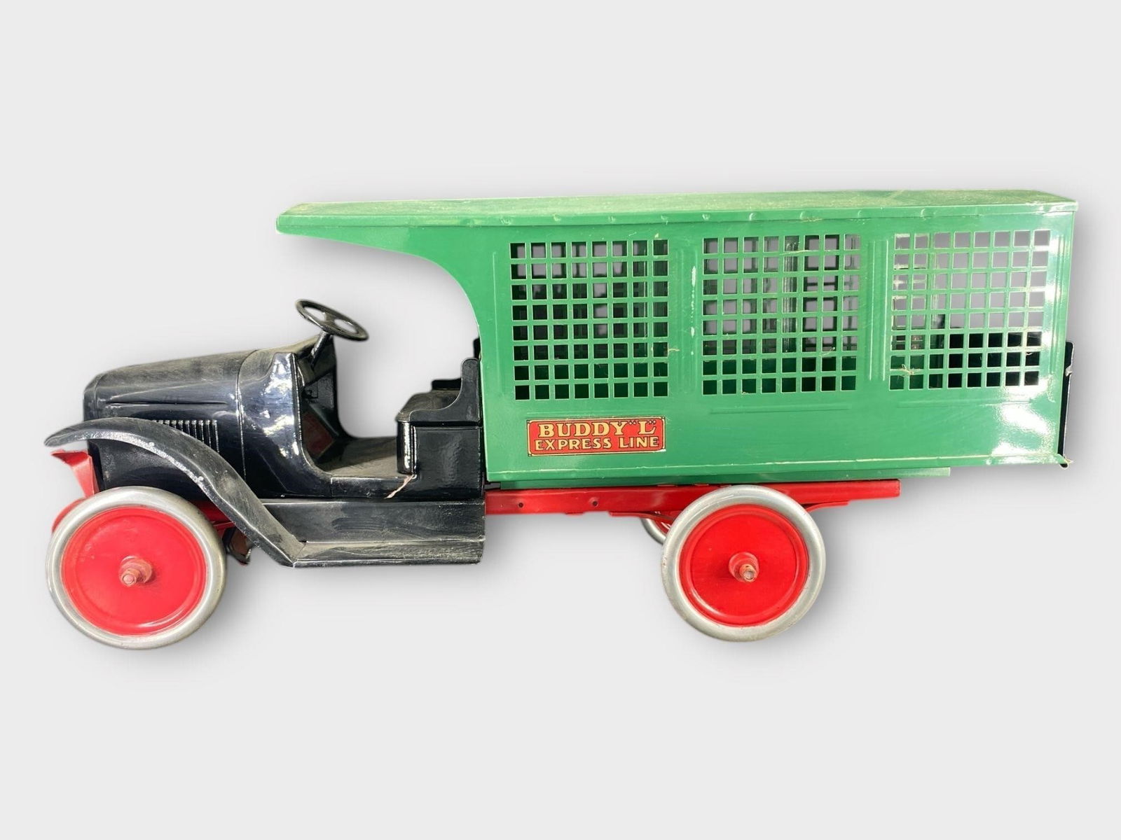 Buddy L Express Line Pressed Steel Truck: Buddy L Express Line Pressed Steel Truck. Black, red, green. Approx. Dimensions (in): 26.5 x 11.25 x 8