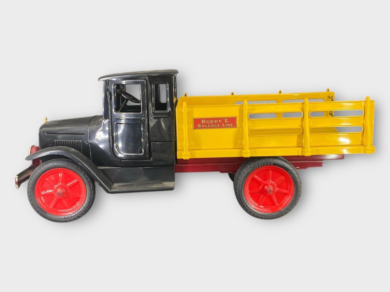 Buddy L Baggage Line Pressed Steel Truck: Buddy L Baggage Line Pressed Steel Truck . Black, red, yellow. Approx. Dimensions (in): 26 x 11.25 x 7.5