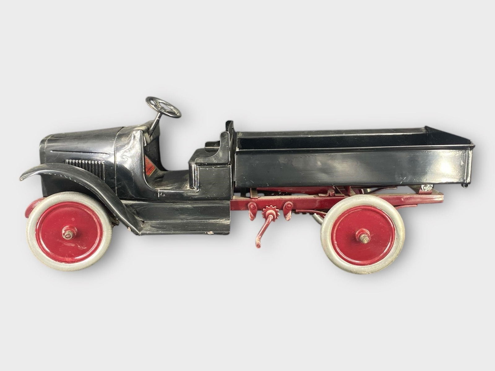 Buddy L Pressed Steel Dump Truck: Buddy L Pressed Steel Dump Truck . Black, red. Approx. Dimensions (in): 23.5 x 9 x 7