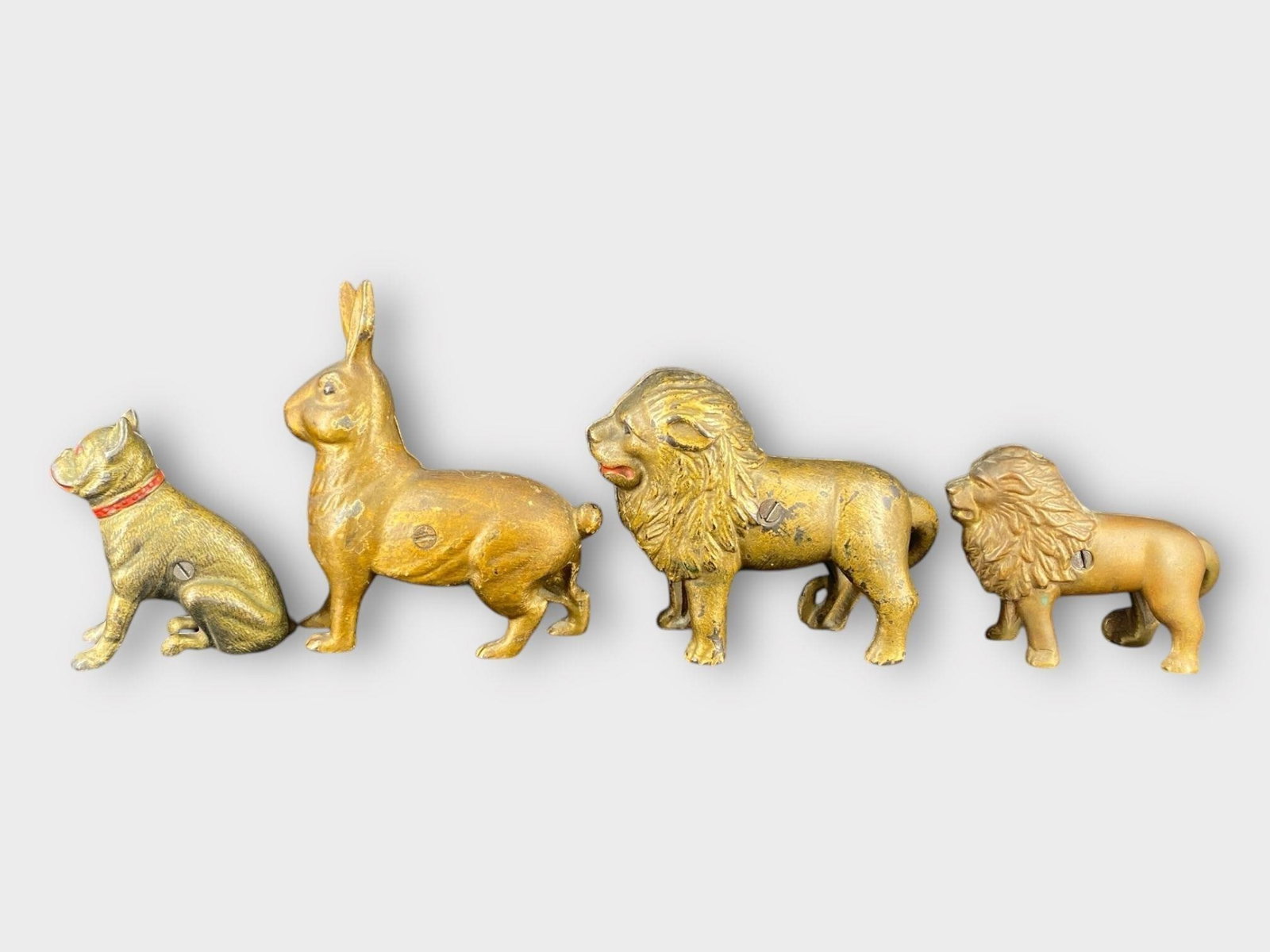 AC Williams Animal Cast Iron Coin Bank, Lot of 4: AC Williams Animal Cast Iron Coin Bank, Lot of 4 . Dog, lion, rabbit. Approx. Dimensions (in): 5 x 6.5
