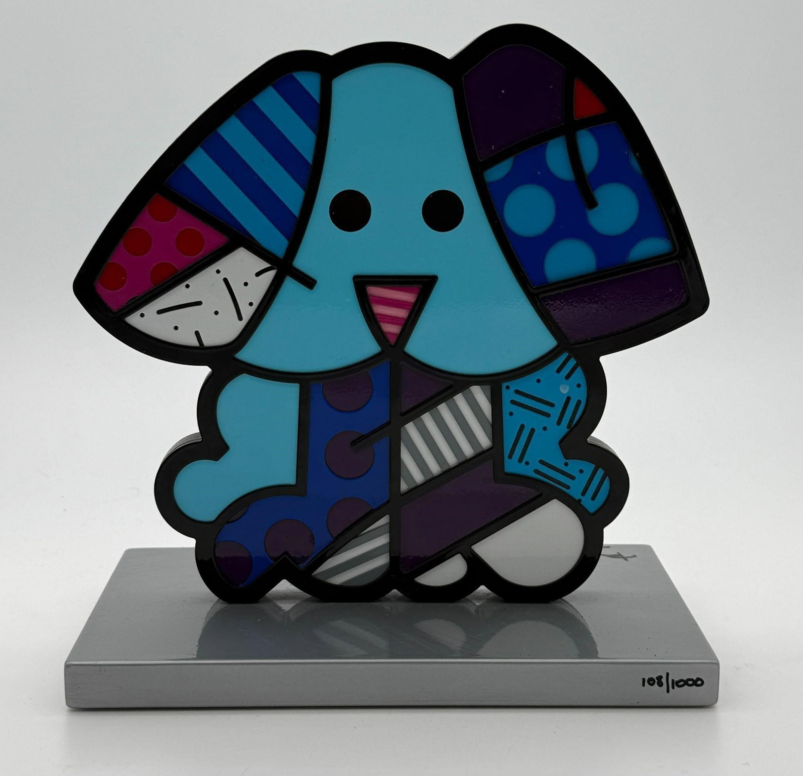 Romero Britto (Brazil, b. 1963) 'Blue Dog': This sculpture depicts a multicolored blue dog. Limited edition #108/1000. Artist signed on the base. Marked 'Britto' on the base. Approx. Dimensions (in): 9 x 8.5 x 5.