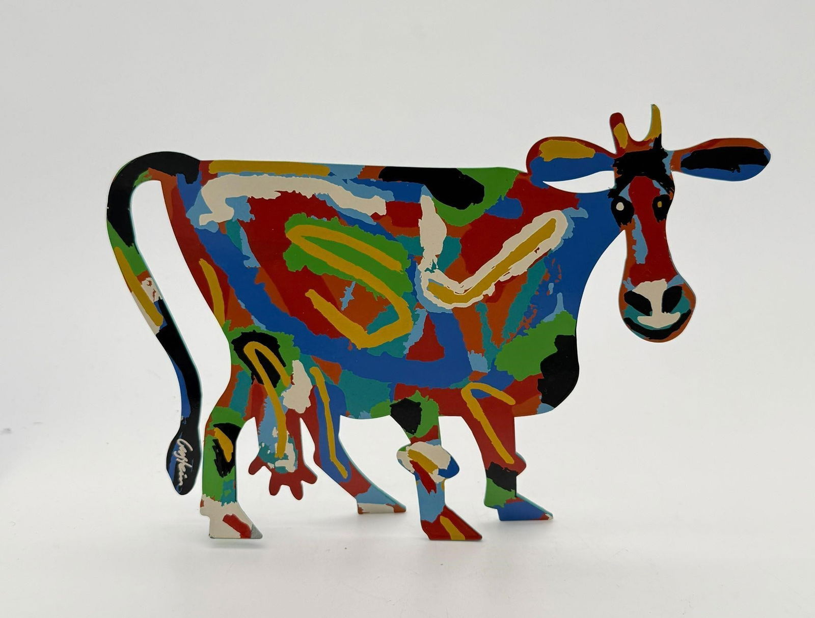 David Gerstein (Israel, b. 1944) Cow Sculpture: This sculpture depicts a multi-colored cow. Pop art metal sculpture. Marked Gerstein on the tail. Approx. Dimensions (in): 6.5 x 9.5.