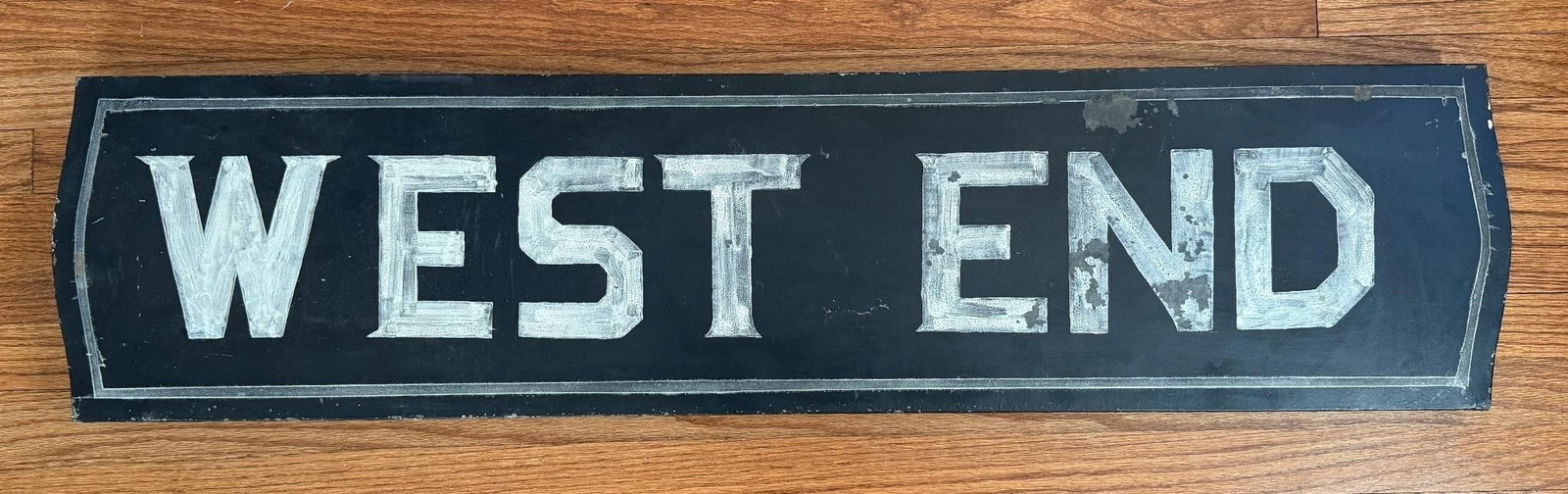 Antique Hand Painted 'West End' Wooden Sign: There is standard age-related wear to this sign. Approx. Dimensions (in): 48 x 11.5 x 1.25.