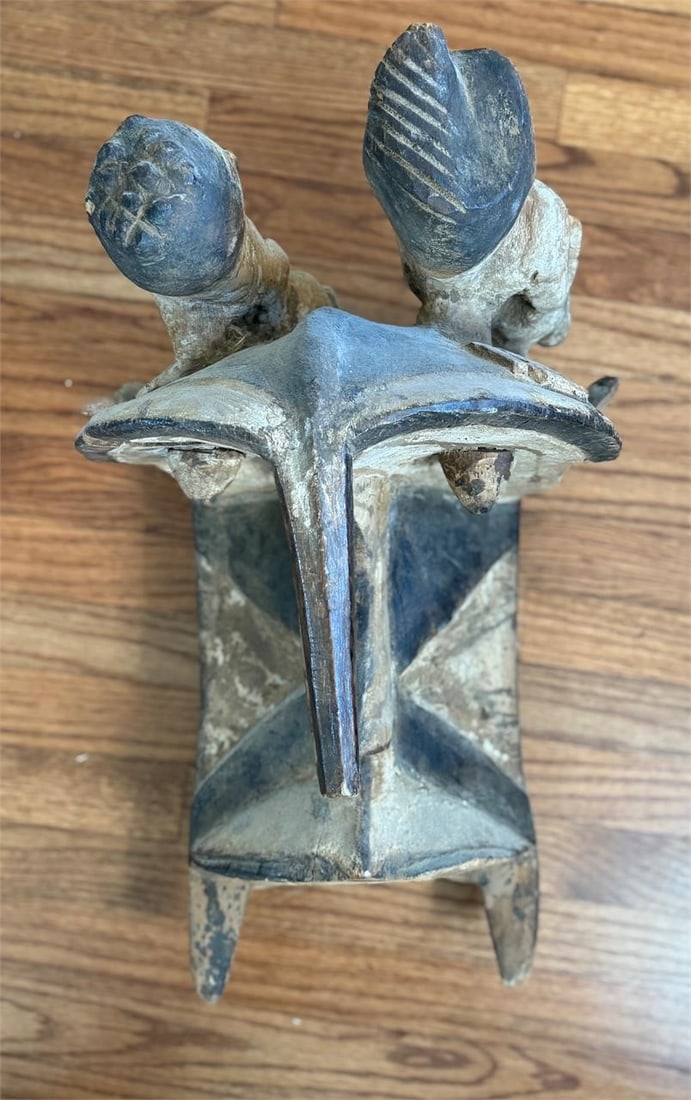 Large Carved Wooden African Tribal Mask Helmet: There are some cracks to the mask. Unknown tribe. This piece is most likely from the Ivory Coast. Approx. Dimensions (in): 15 x 20.5 x 13.