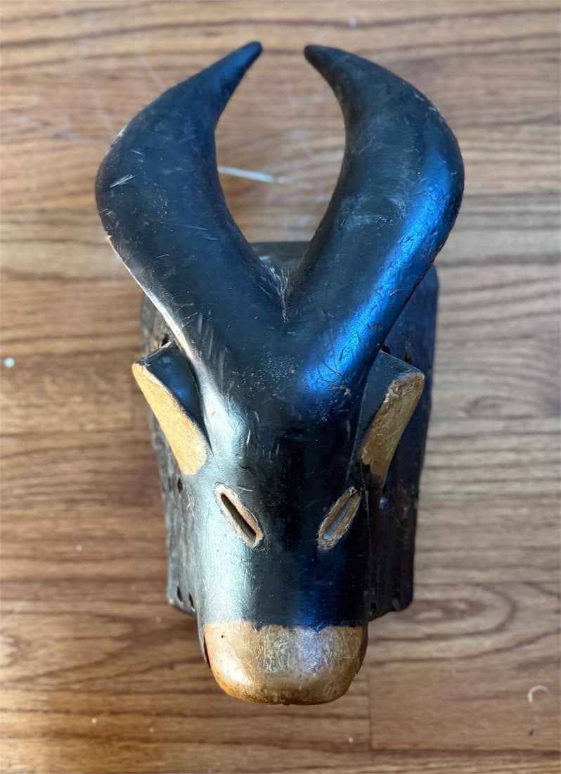Carved Wooden African Tribal Animal Cow Pig Mask: This mask is in the shape of a cow or a pig. Unknown tribal origin. Approx. Size (in): 16.5 x 8.5 x 6.