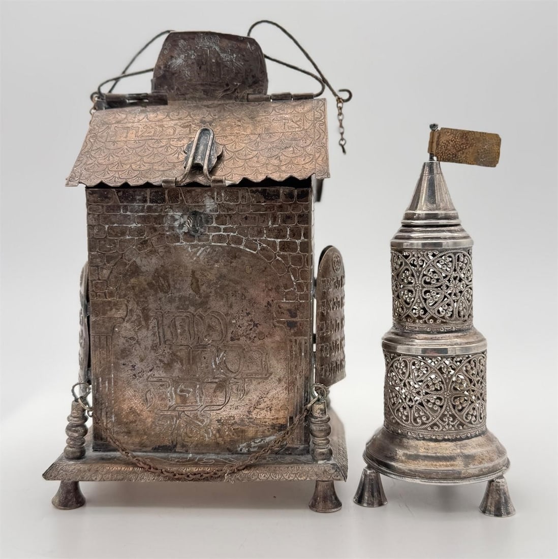 Silver Plated Judaica Tzedakah & Spice Box: The charity box has Hebrew writing on each side. Both pieces are unsigned. Approx. Dimensions (in): 9 x 5.25 x 4.