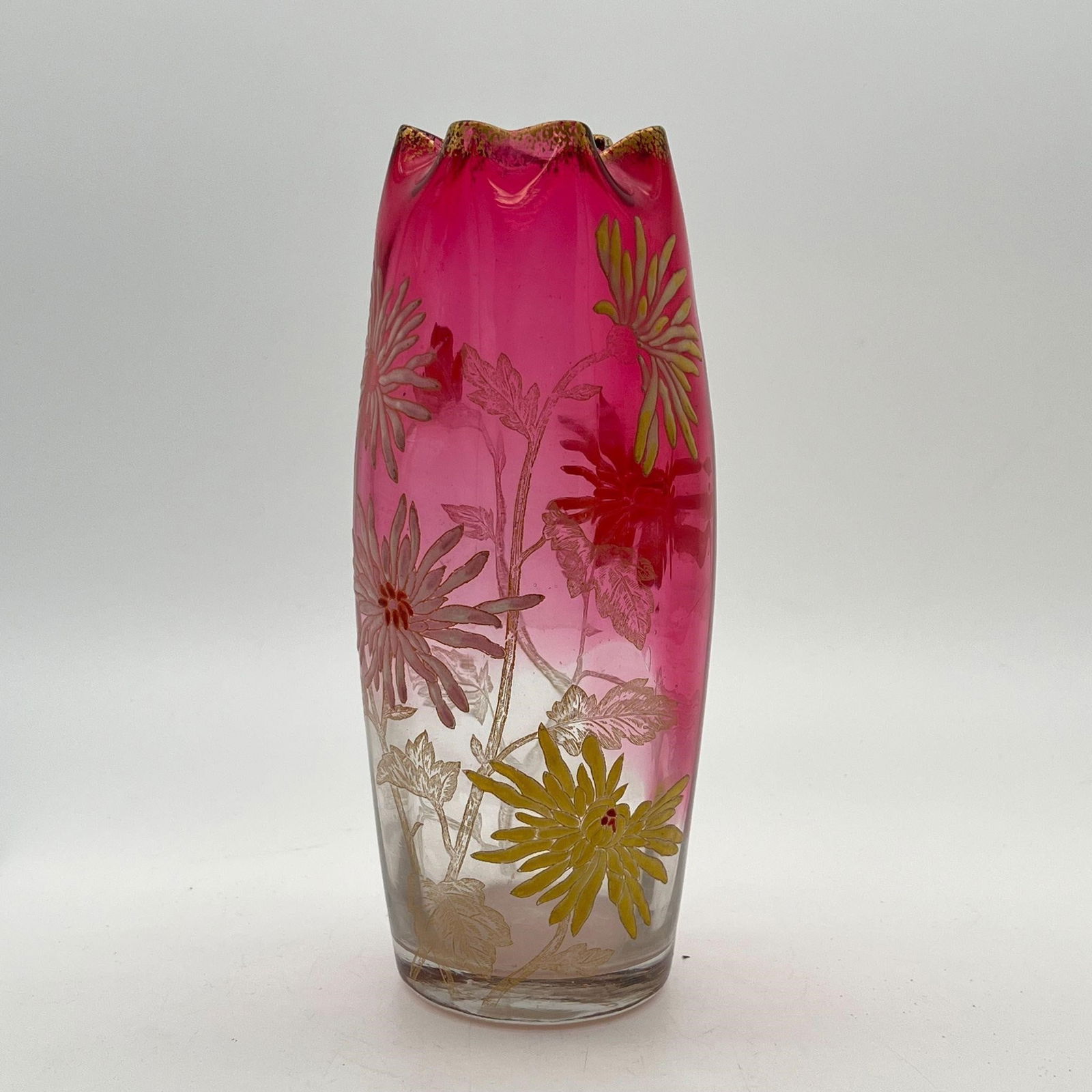Glass & Gilt Mt. Joy France Cranberry Clear Vase: Gilt floral design. Unsigned. Approx. Dimensions (in): 10 x 3.75 x 3.75.