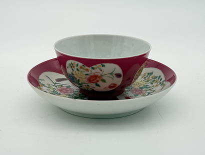 Qing Dynasty Famille Rose Porcelain Cup & Saucer: This piece is unsigned. This cup and saucer is a deep red color with a floral design with crabs / spiders. Approx. Dimensions (in): 5.5 x 1.75.