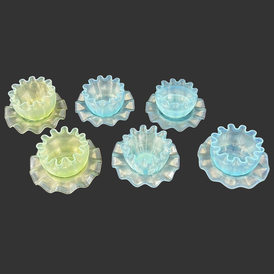 Lot of 6 Opalescent Uranium Finger Bowls: Lot of 6 Opalescent Uranium Finger Bowls. 2/6 are uranium glass. Approx. bowl dimensions (in): 2.25 x 3 x 3, Approx. underplate diameter (in): 4.5. Buyer pays shipping cost. We provide in-house shippi