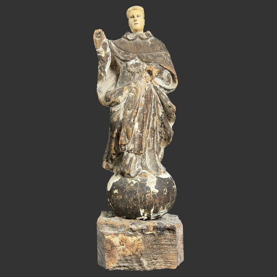 Saint Francis of Assisi Santos Wooden Figurine: Saint Francis of Assisi Santos Wooden Figurine. The figure is identified as Saint Francis of Assisi, a revered figure in Christianity known for his love of nature and animals, often depicted in a humb