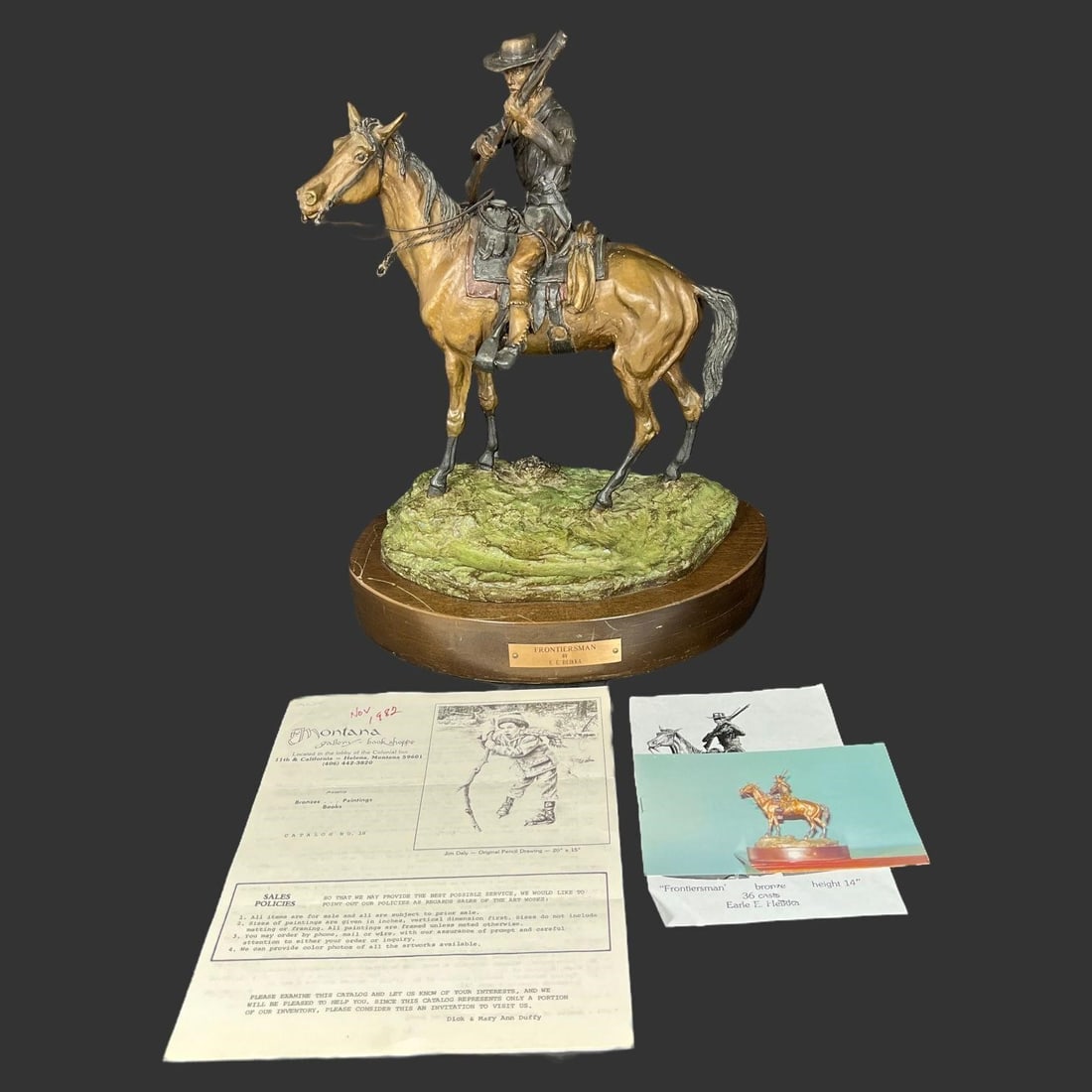 Frontiersman By Earle Erik Heikka (1910-1941): Bronze sculpture by American artist Earle Erik Heikka (1910-1941). Sculpture depicts a cowboy riding a horse and holding a rifle. Heikka was a Montana sculptor known for his naturalistic works depicti