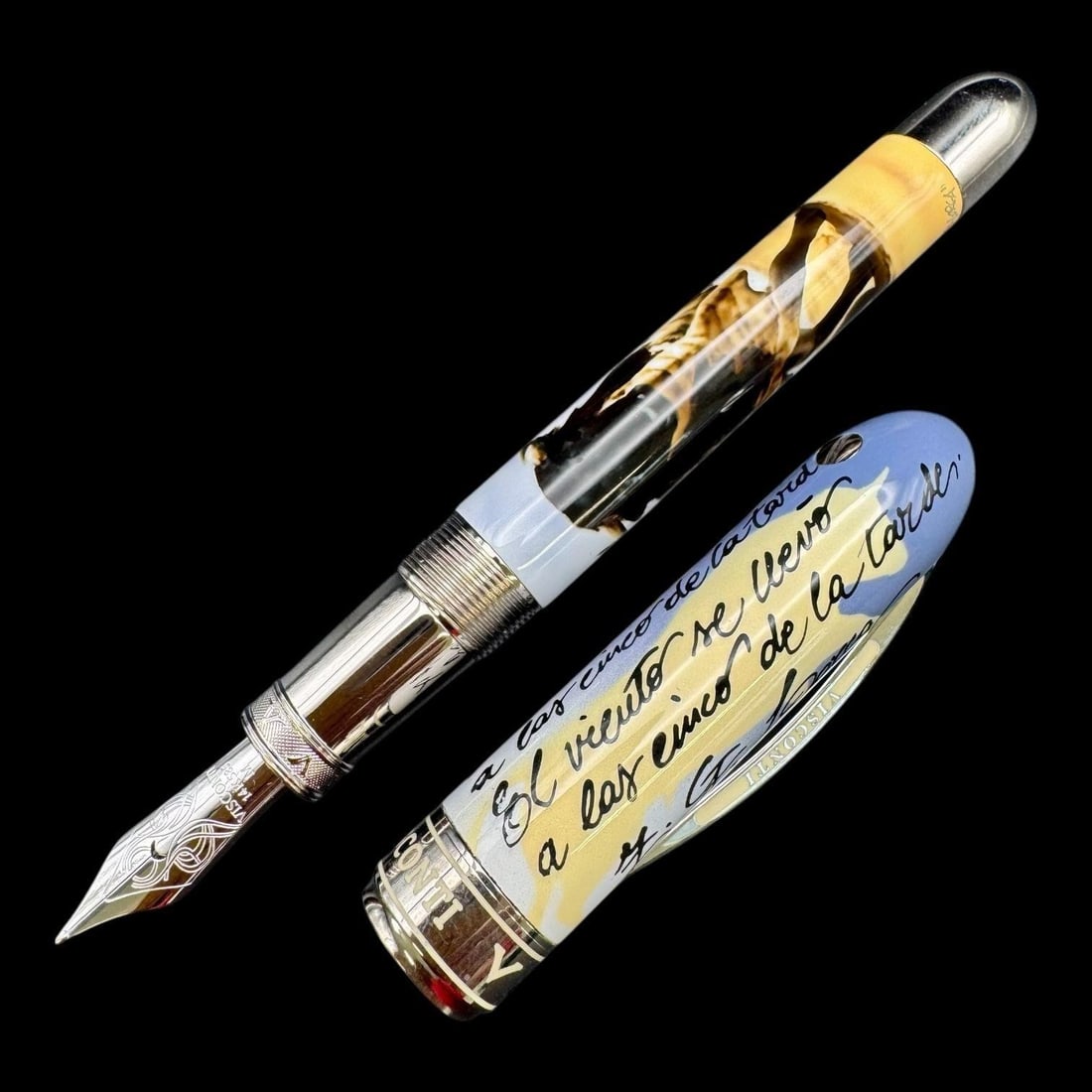 Visconti Pen Mazzi Federico Garcia Lorca Pen: The cap of the pen is hand-painted with lines from the poet's work, specifically "Lament For The Death Of A Bullfighter". The artwork on the barrel depicts a charging bull, and the artist's name, Clau