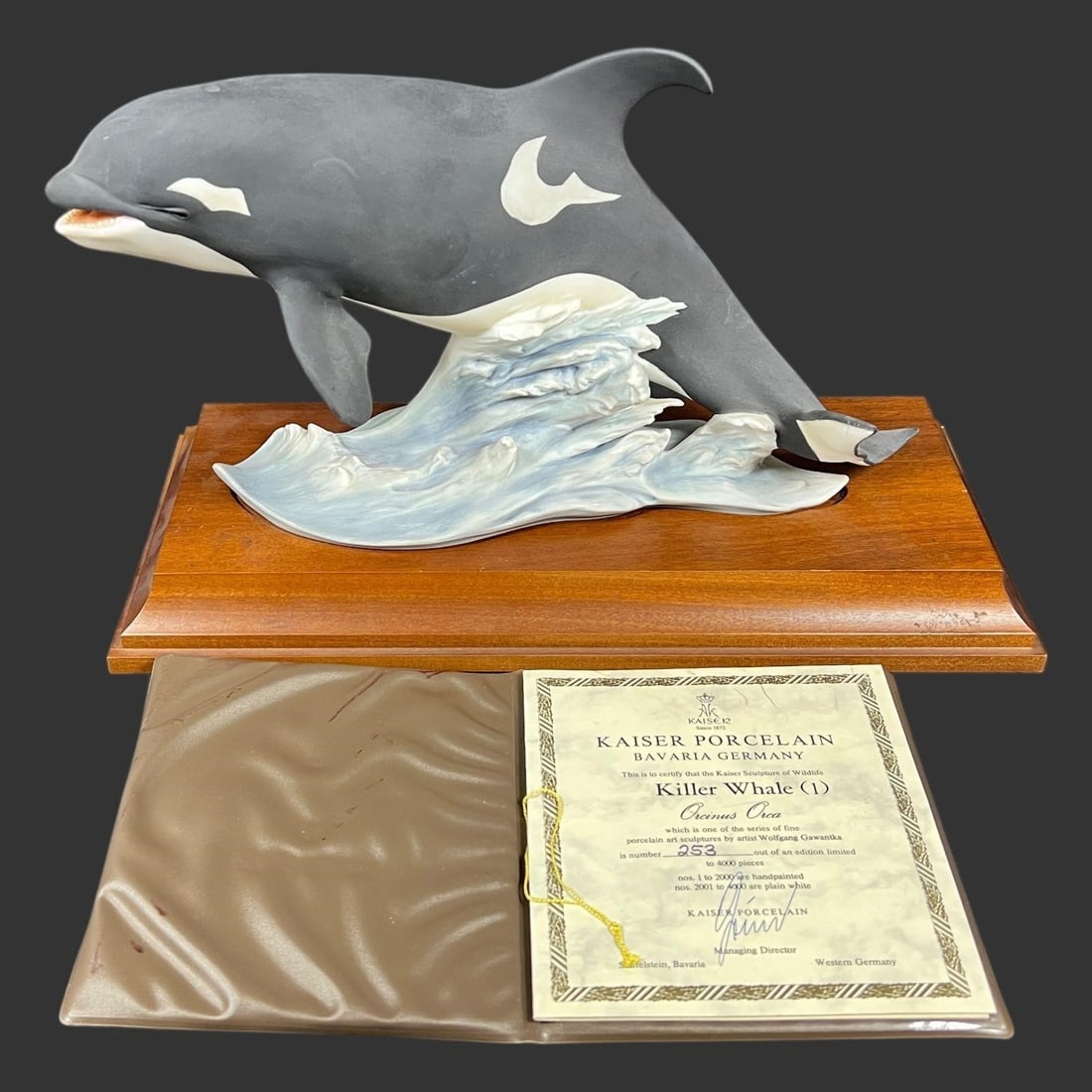 Kaiser Porcelain Killer Whale Orca Figurine: Kaiser Porcelain figurine of a Killer Whale (Orcinus Orca) by artist Wolfgang Gawantka. A single killer whale (Orcinus Orca) depicted leaping from a wave base, mounted on a wooden plinth.This is #253 
