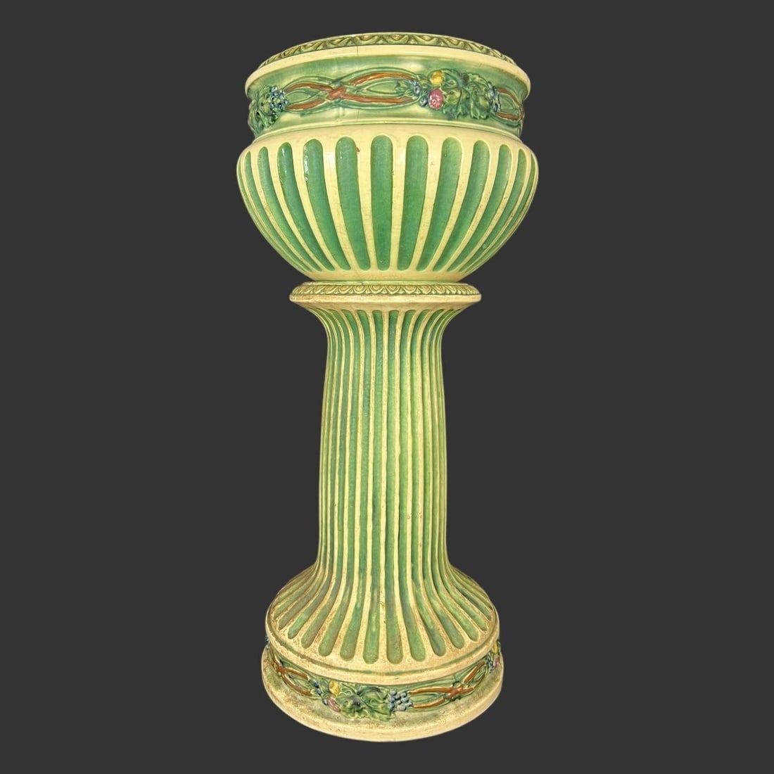 Roseville Pottery Corinthian Jardinière & Pedestal: Roseville Pottery "Corinthian" jardinière and pedestal. The Corinthian pattern was introduced by the American art pottery company in 1923 and is known for its classical design and rich green glaze wi