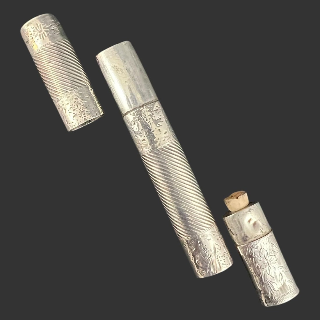 Sterling Silver Needle Case Etui: Antique sterling silver combination vinaigrette and scent bottle or possibly a needle case. The intricate floral and swirl patterns (known as chased or engraved designs) are characteristic of Victoria