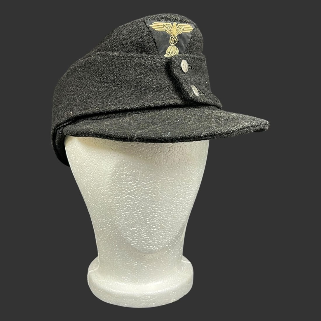 WWII German Luftwaffe M43 Field Cap Hat: WWII German Luftwaffe M43 field cap, also known as an Einheitsfeldmütze. This style of cap was widely used by all branches of the German Wehrmacht during the later stages of the war. It features the 
