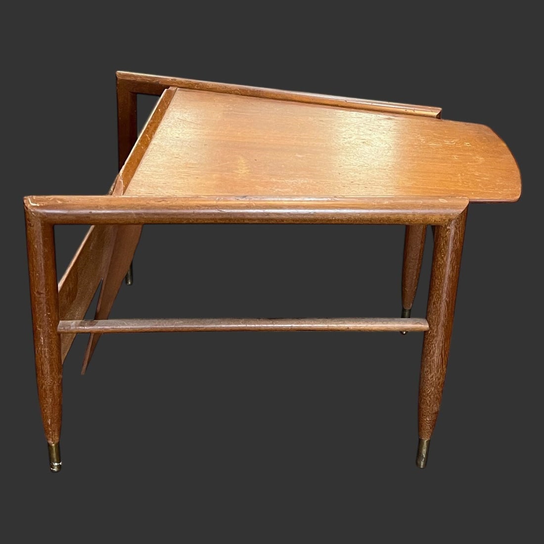 Mid-Century Modern "Wedge" Magazine Side Table: Mid-century modern "Wedge" magazine side table designed by John Keal for the furniture manufacturer Brown Saltman. The table has a distinctive trapezoid or wedge-shaped top flanking a built-in magazin