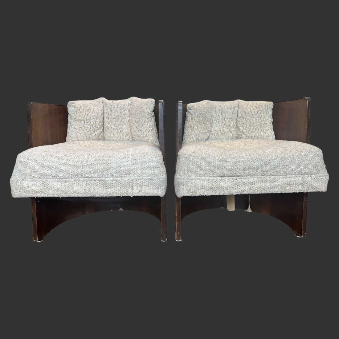 Mid-Century Modern MCM Slipper Lounge Chairs: The frame is constructed from a dark wood, likely walnut, known for its rich hues and use in mid-century design. The base features a unique, curved architectural design. The chairs are upholstered in