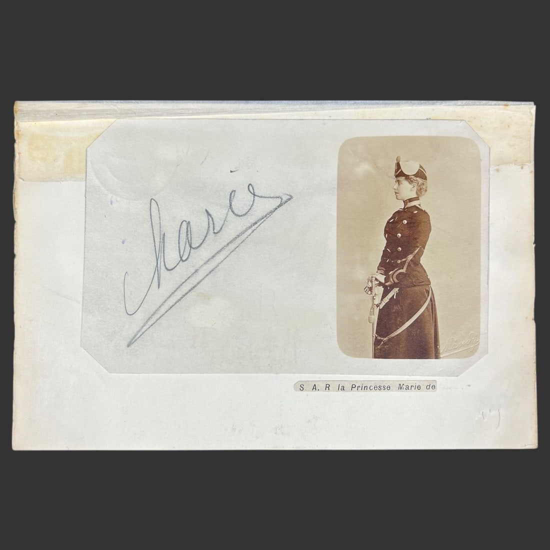 Princess Marie of Romania Signed Photo Card: Offered here is a fine mounted autograph and portrait card attributed to Crown Princess Marie of Romania, featuring a bold graphite signature reading "Marie" alongside a period photographic portrait.