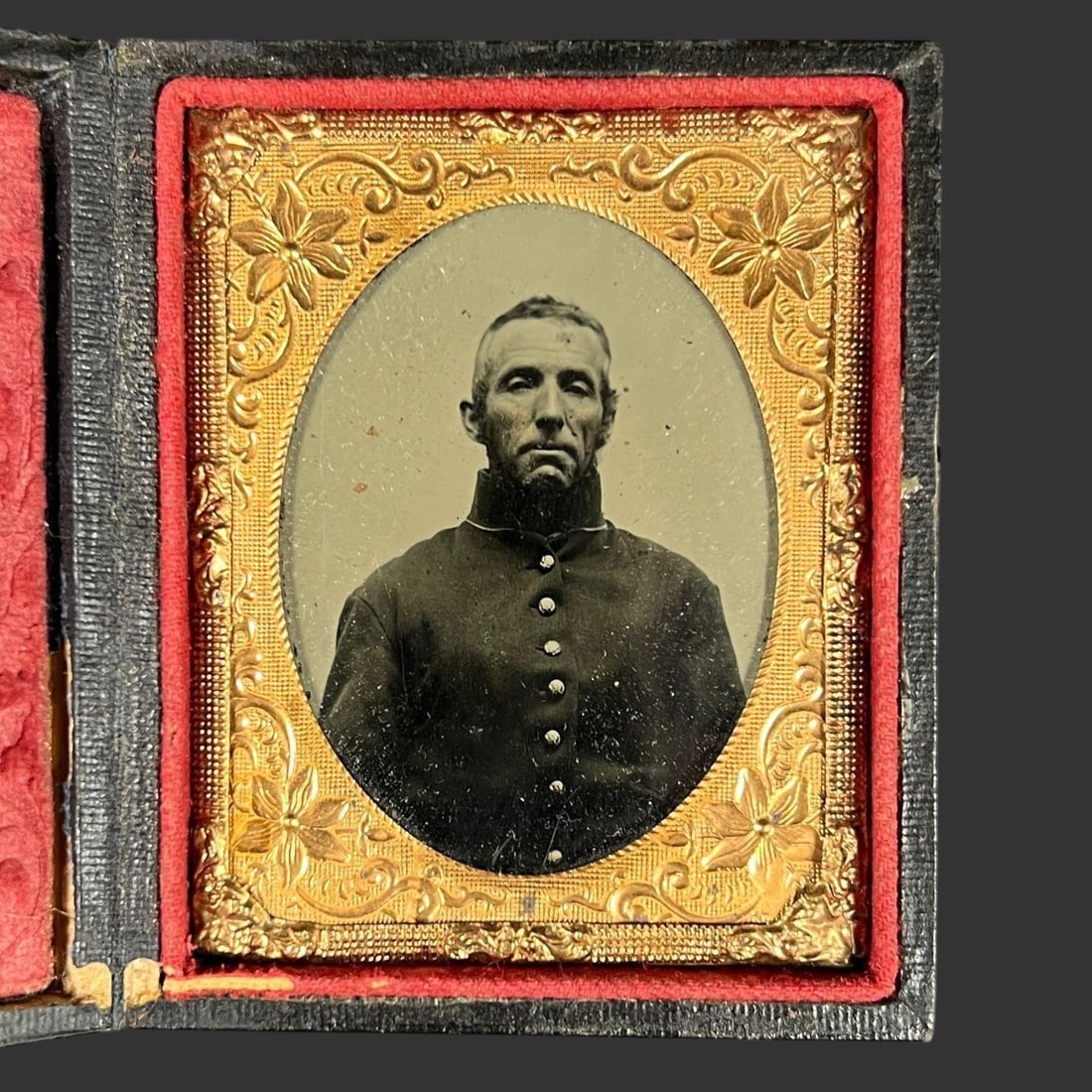 Civil War-Era Daguerreotype of Union Soldier: This original mid-19th-century daguerreotype presents a solemn and powerfully rendered portrait of a Union soldier, captured with the distinctive clarity and reflective depth characteristic of the dag