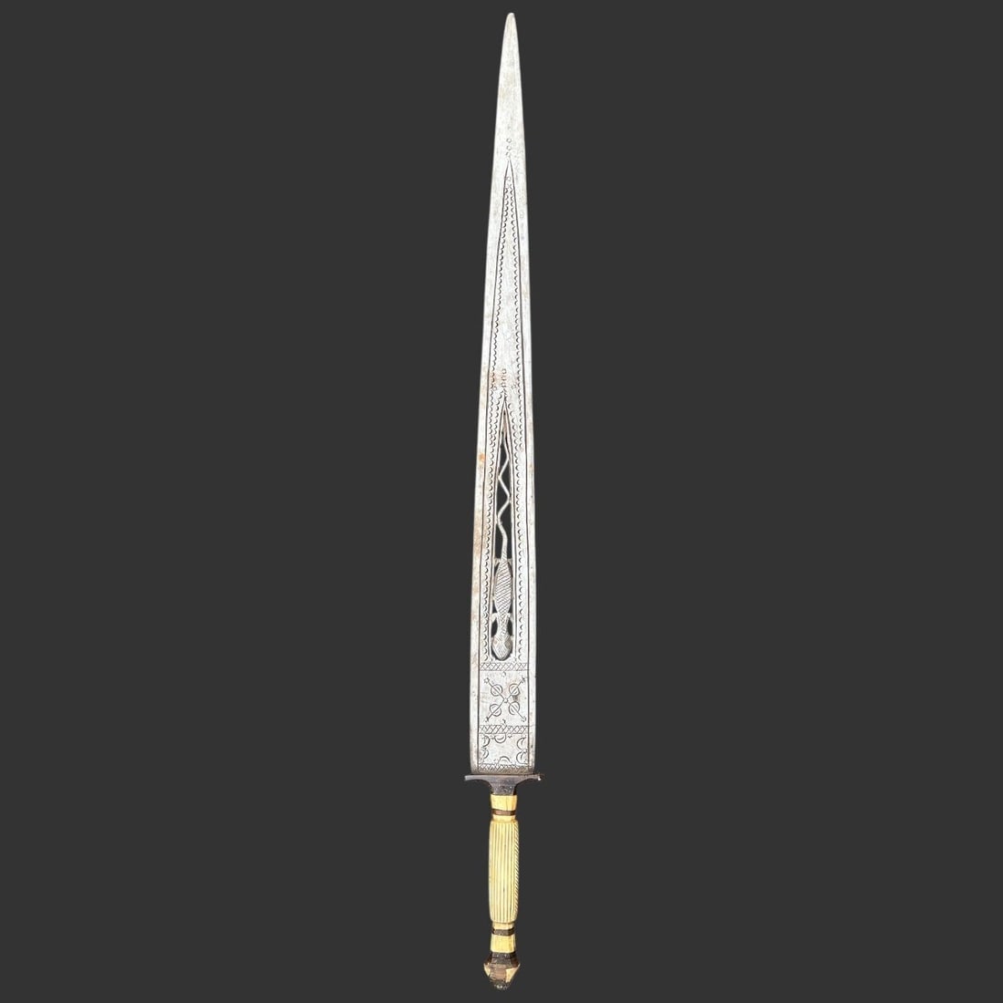 Sudanese Sudanist Period Engraved Dagger: This antique dagger is believed to be of Sudanese origin and reflects decorative metalwork traditions associated with the Sudanist period of the late 19th century, when Islamic and regional African de