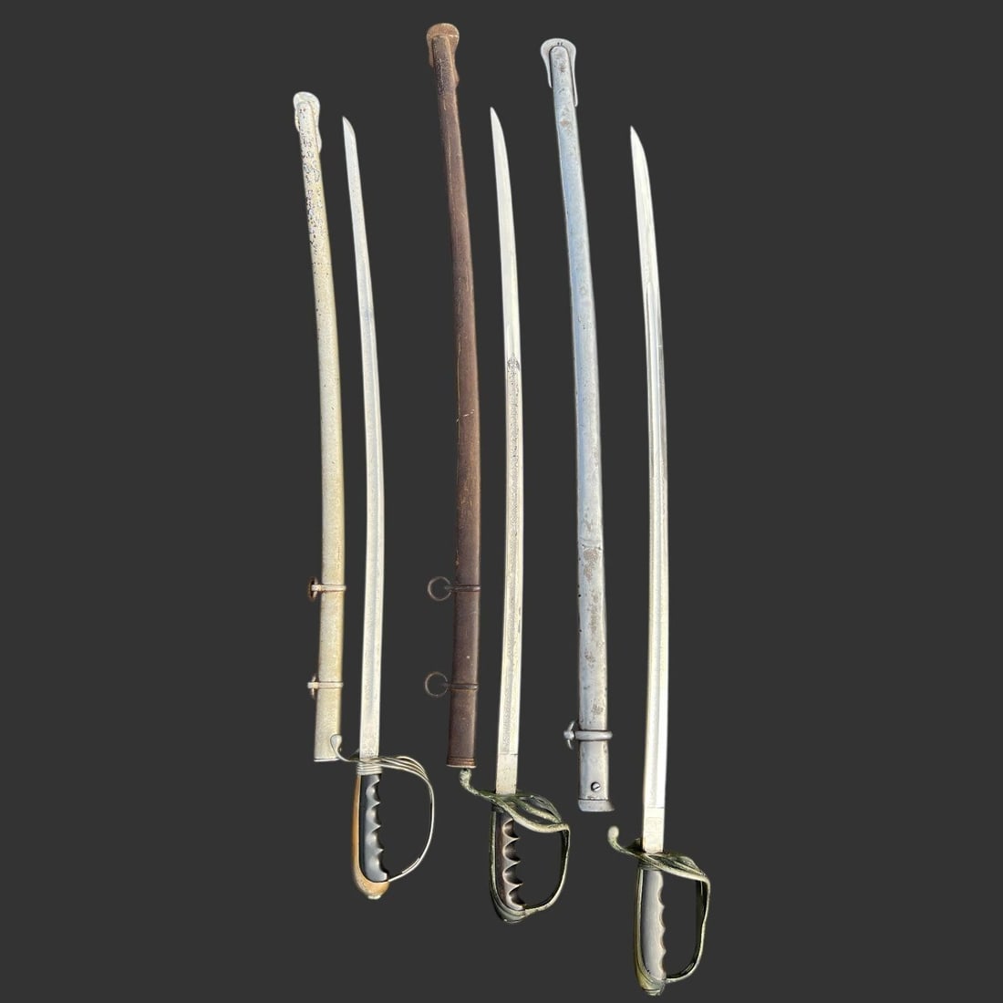 Group of American Ceremonial Sabers (3): Group of three American ceremonial sabers with curved etched blades and ribbed grips, retailed by noted New York military outfitters. Maker / retailer marks include "Henry V. Allien & Co., New York,"