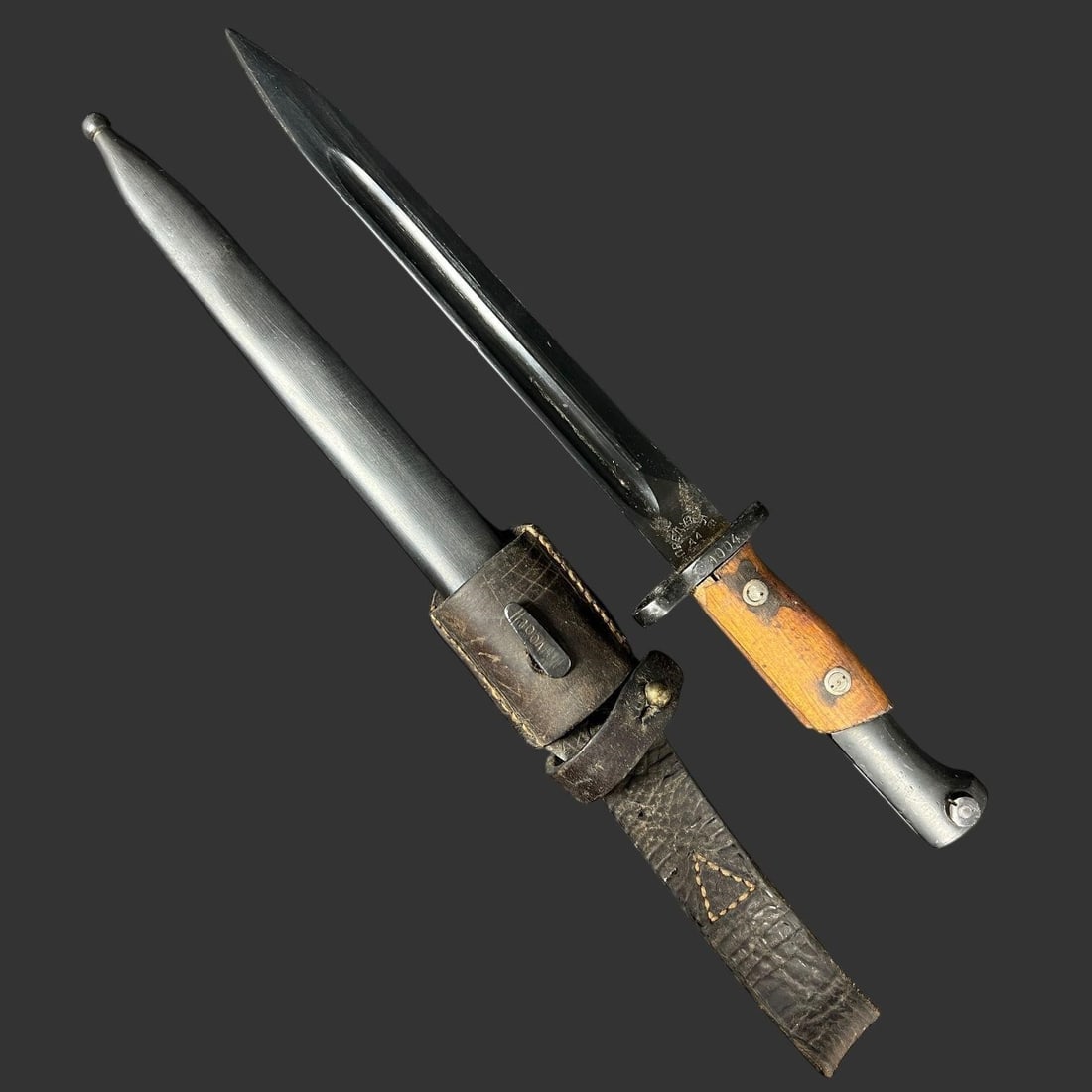 WWII German K98 Bayonet by Elite-Diamant 44: This is an attractive and increasingly scarce late-war German K98 bayonet, manufactured by Elite-Diamant in 1944, retaining its matching scabbard and original leather frog. The blade shows the classic