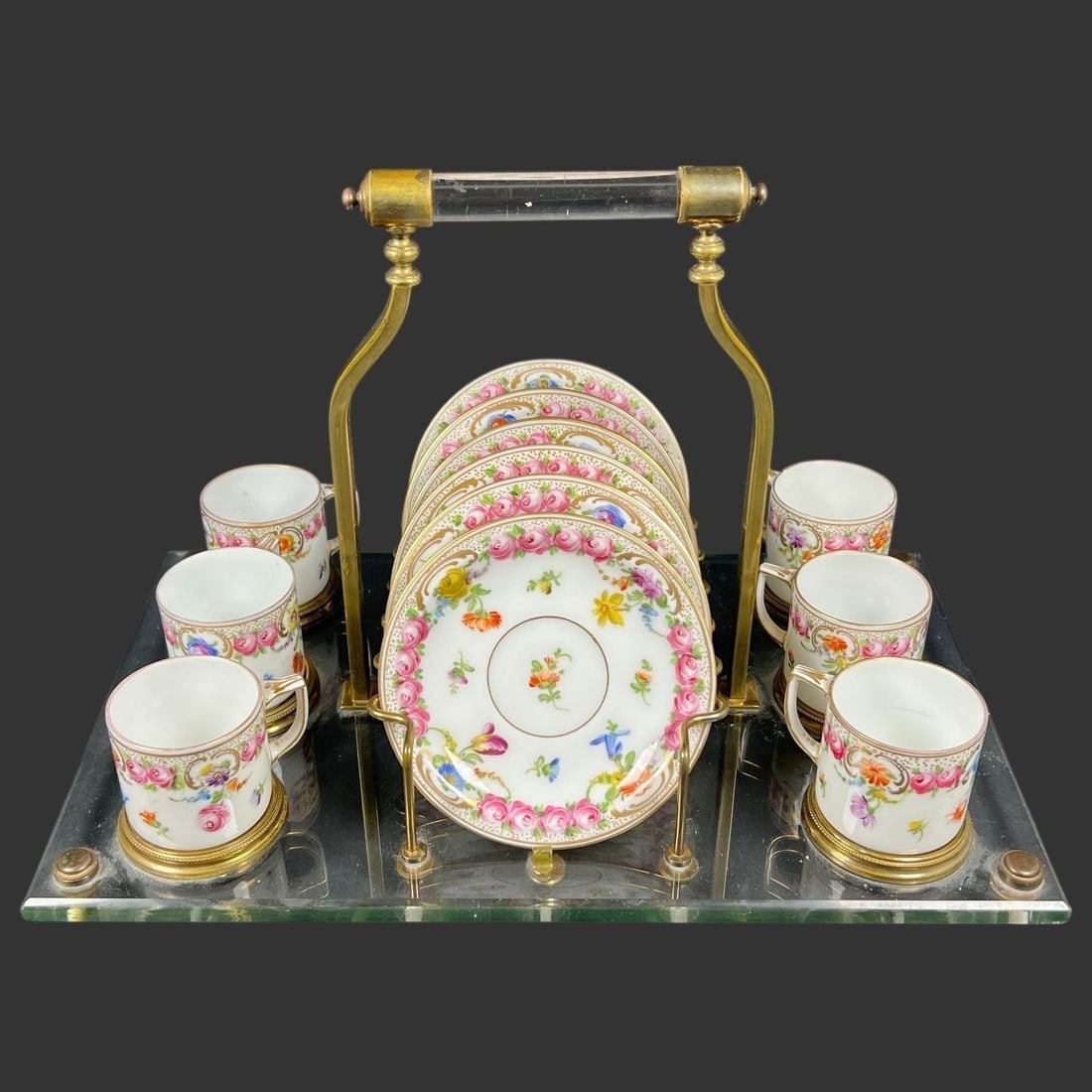Dresden Porcelain Demitasse Set w/ Brass Stand: Antique, elegant German porcelain demitasse service presented in its original gilt brass and glass stand, featuring finely hand-painted floral decoration throughout. The set includes six demitasse cup