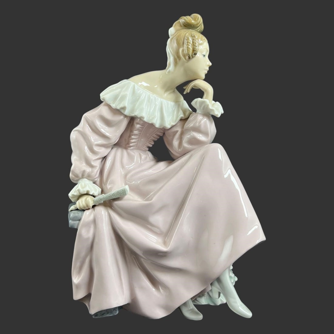 Lladro Spain Porcelain #5378 'Time for Reflection': Elegant Lladro porcelain figurine depicting a seated young woman in an 18th-century inspired gown, shown resting thoughtfully on a classical garden bench. The figure is finely modeled with flowing pas