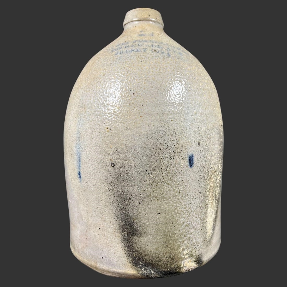 Antique Lewis Fischer Stoneware Jug, Jersey City: Offered is an authentic 19th-century American stoneware jug boldly stamped "Lewis Fischer, 109 Newark Ave, Jersey City" beneath a classic cobalt-blue decorative device, identifying one of New Jersey's