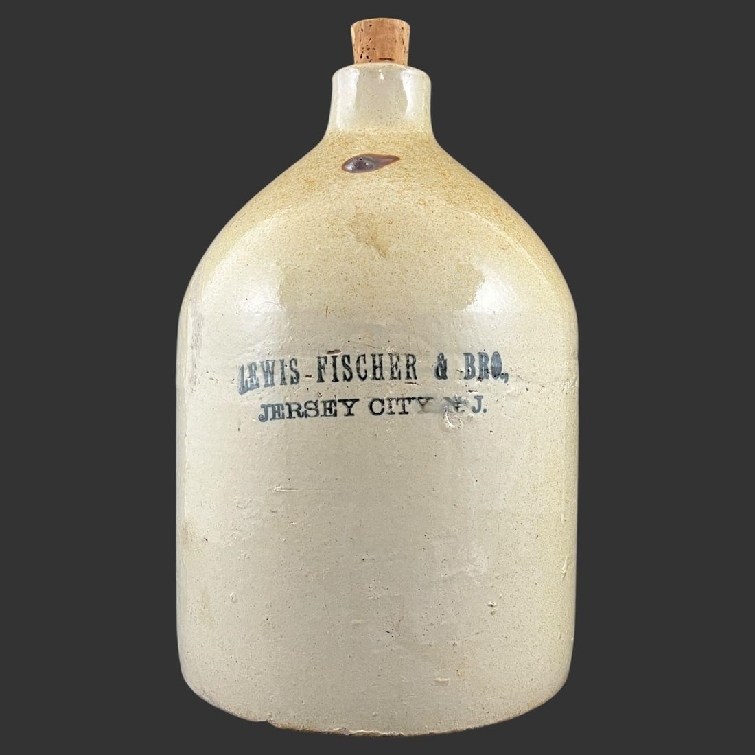 Levis Fischer & Bro. Jersey City Stoneware Jug: This is an original 19th-century American stoneware jug boldly stenciled "LEVIS FISCHER & BRO., JERSEY CITY, N.J.", a scarce merchant mark associated with late-1800s liquor and beverage distribution i