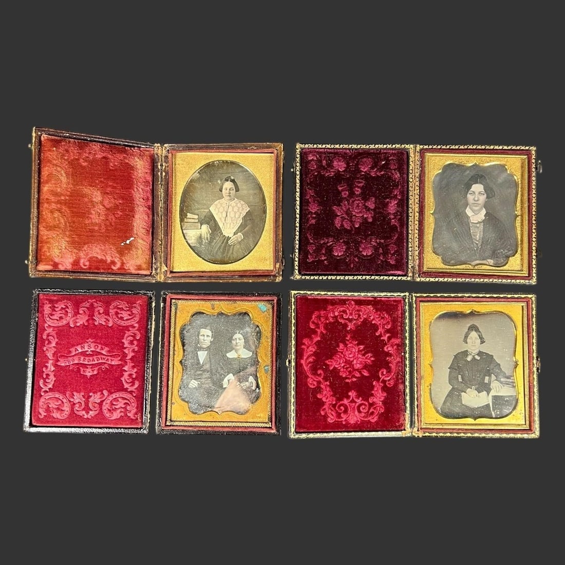 Four 19th C. Daguerreotypes in Ornate Union Cases: A compelling group of four mid-19th century daguerreotypes, each housed in its original hinged Union case with richly embossed exterior designs and velvet interiors. The group includes individual and
