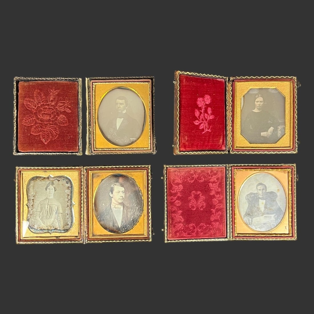 Early Daguerreotype Portraits in Ornate Cases (4): Group of 4 mid-19th century daguerreotype portraits, each housed in its original hinged case, featuring a variety of embossed leather and thermoplastic designs with gilt highlights. The portraits depi