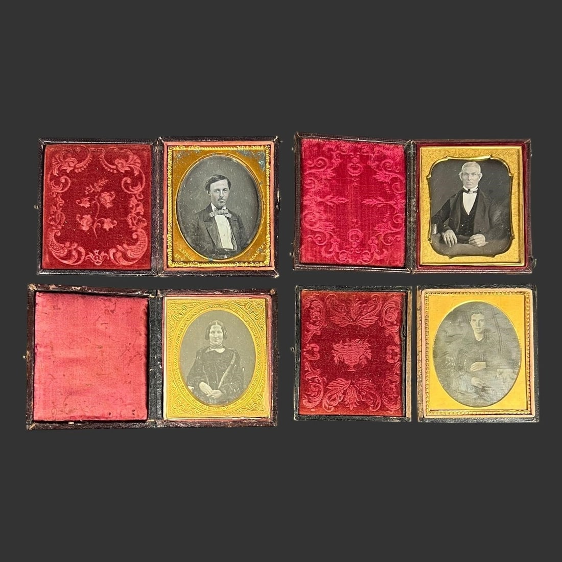19th-Century Daguerreotype Cased Portraits (4): This lot contains four original mid-19th-century American daguerreotype portraits, each housed in its original hinged leather or paper-covered case with gilt brass mats and period velvet or silk pads.