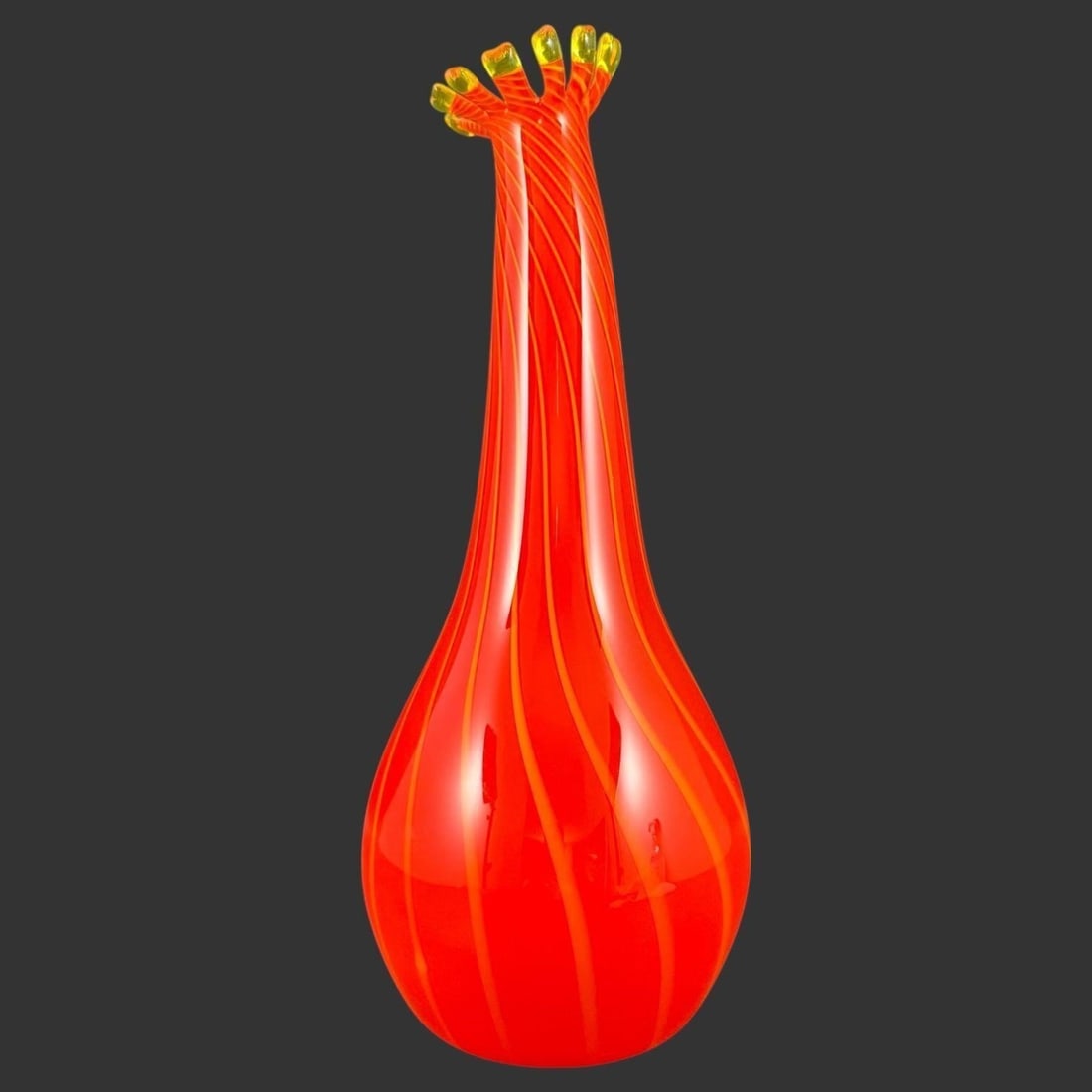 Signed Hand-Blown Art Glass Vase with Ruffled Rim: This striking hand-blown Murano art glass vase features a tall, elegant form with a bulbous lower body rising to a slender neck and a dramatically ruffled rim, executed in vivid red glass with swirlin